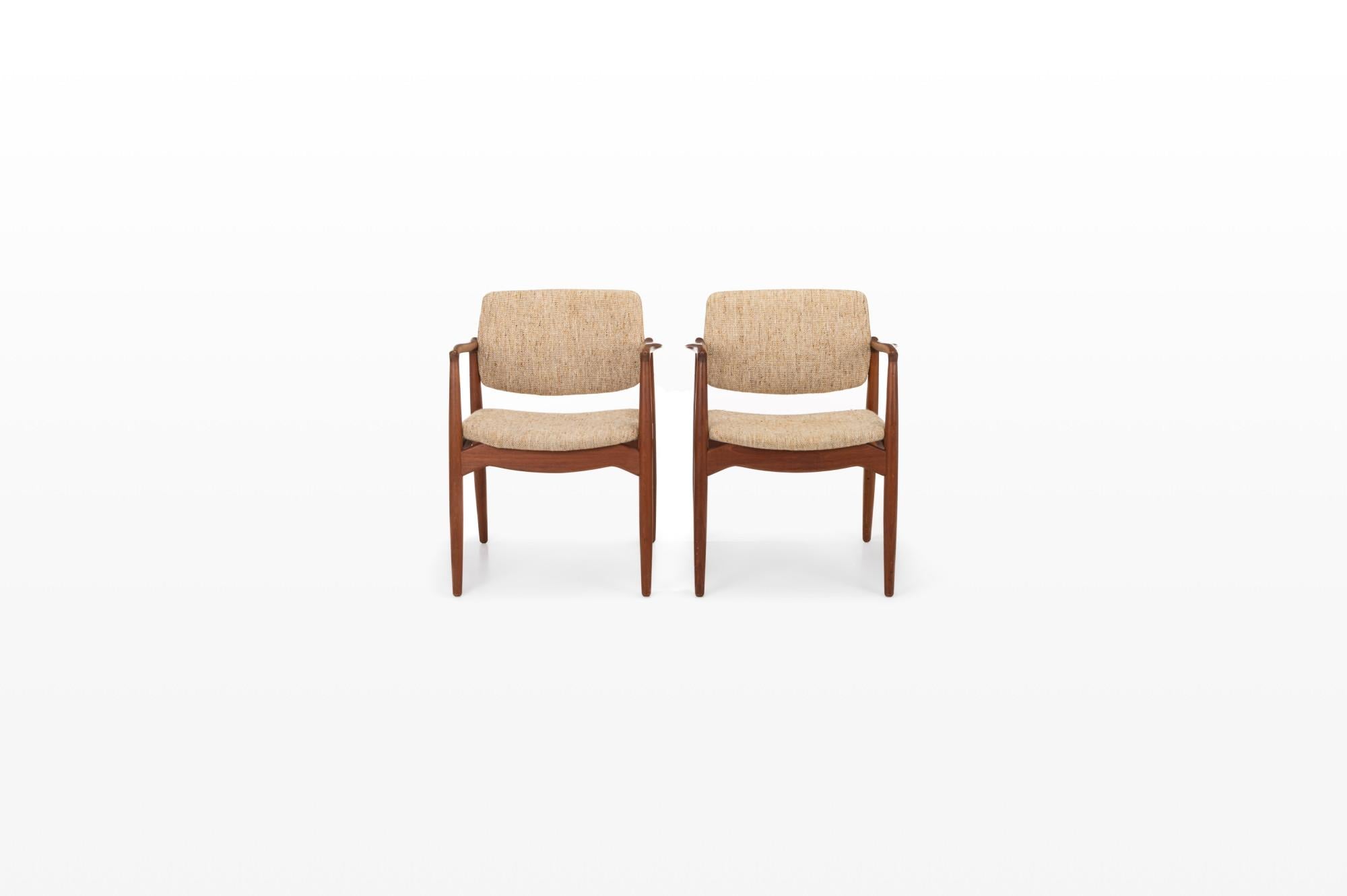 Pair of Captain's chairs designed by Erik Buch for Ørum Møbler, Denmark 1960s. These beautiful armchairs are made of teak and still have the original wool upholstery. The pair remains in very good condition.