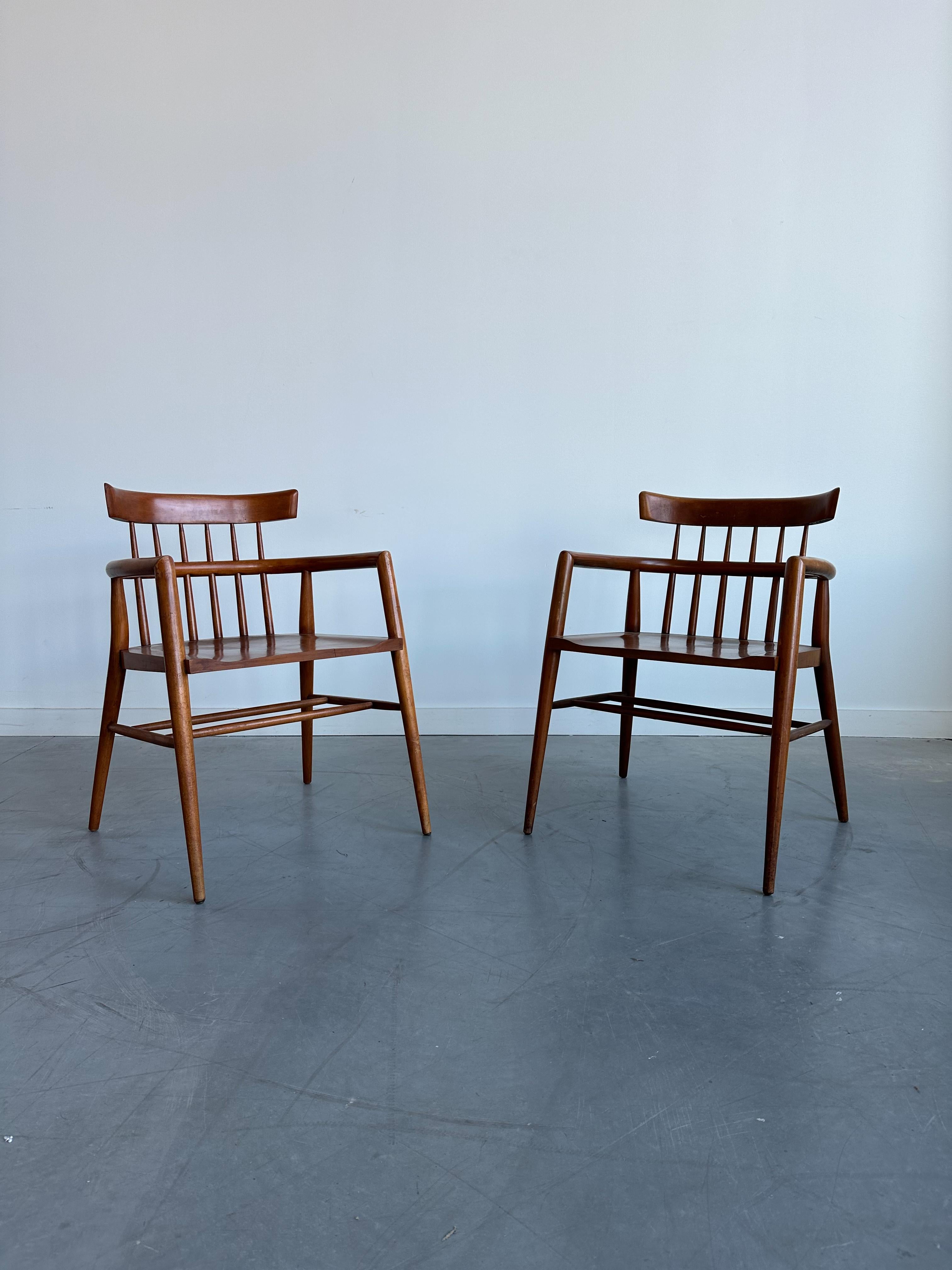 Paul McCobb Planner Group Captain arm chairs. Solid maple seat and curved back on tapered legs. Solid maple seat and curved back on tapered legs. Original vintage condition. 
