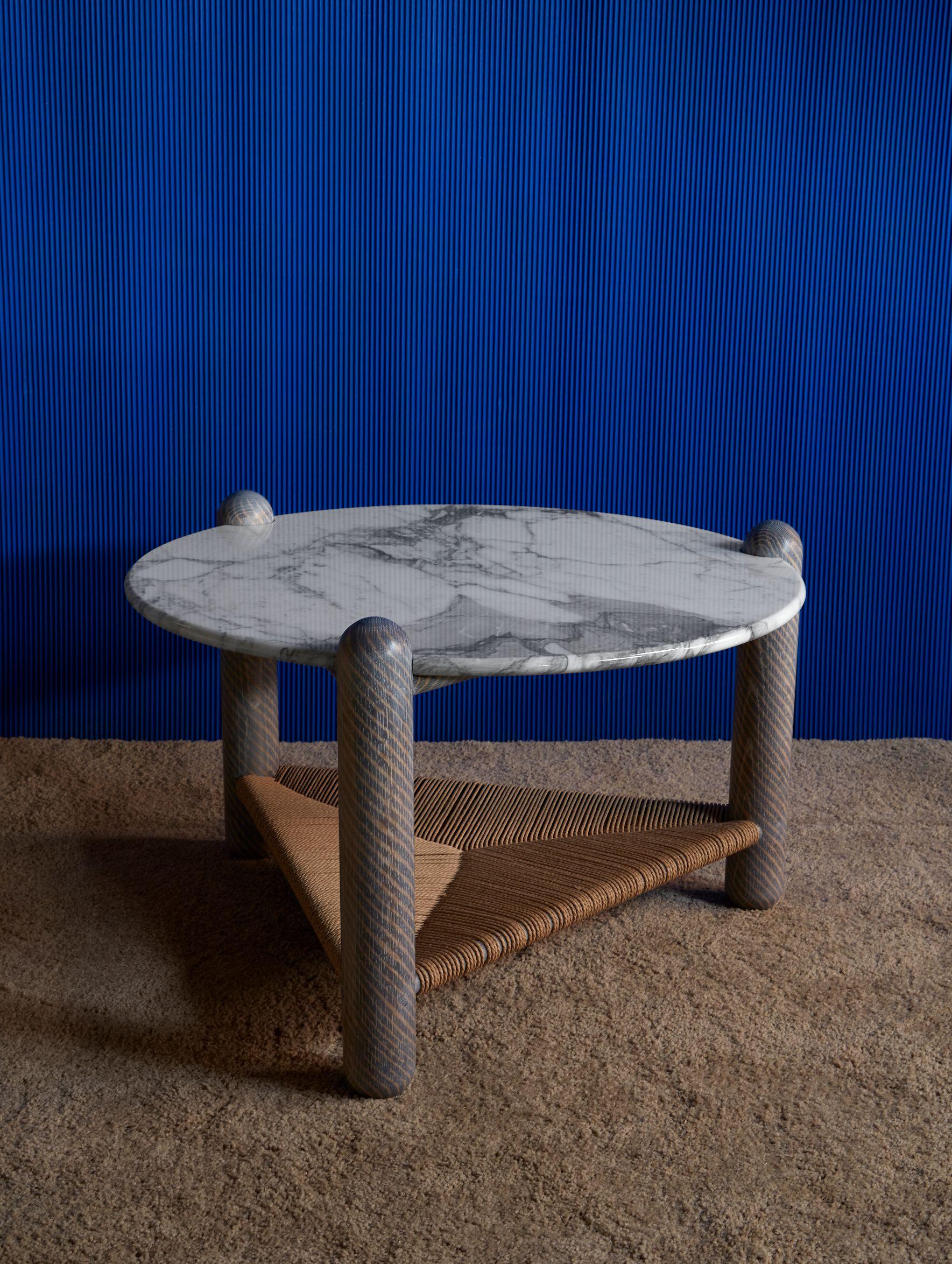Captain's coffee table by Hamilton Holmes
Oxalino Collection 
2020
Dimensions: D 76.2, W 76.2, H 45.8 cm
Materials: White oak, Calcatta marble, natural Danish cord, and oxidized treatment

These solid oak three-legged tables feature handwoven