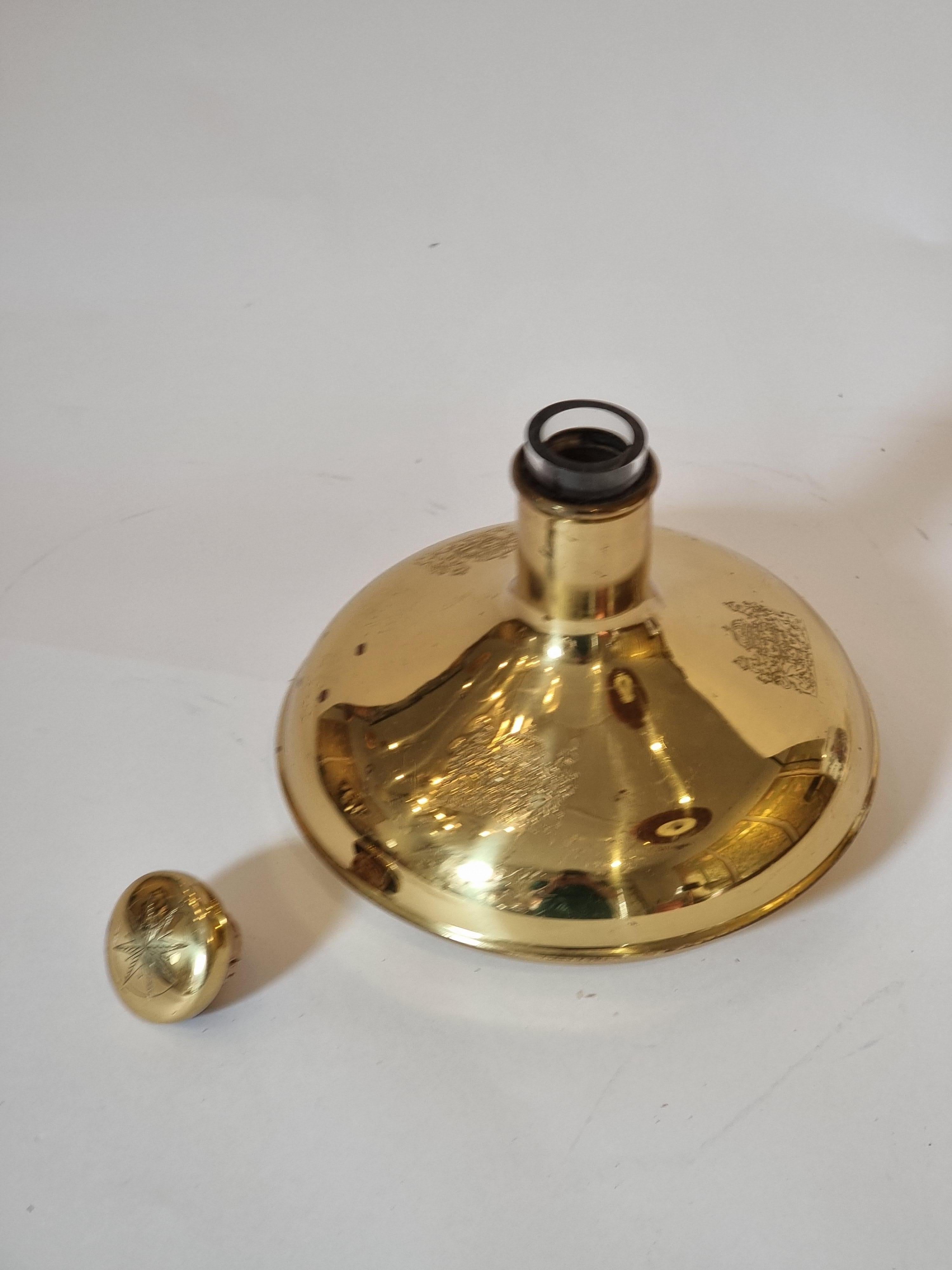 `Captain's decanter/ Kaptens karaff`, made by Norrsken metall, Sweden late 1900s. In good condition, smaller signs of age and use. One small dent underneath bottle, brass with darker spots. 

Copy of HM Queen Christina's decanter which was handed