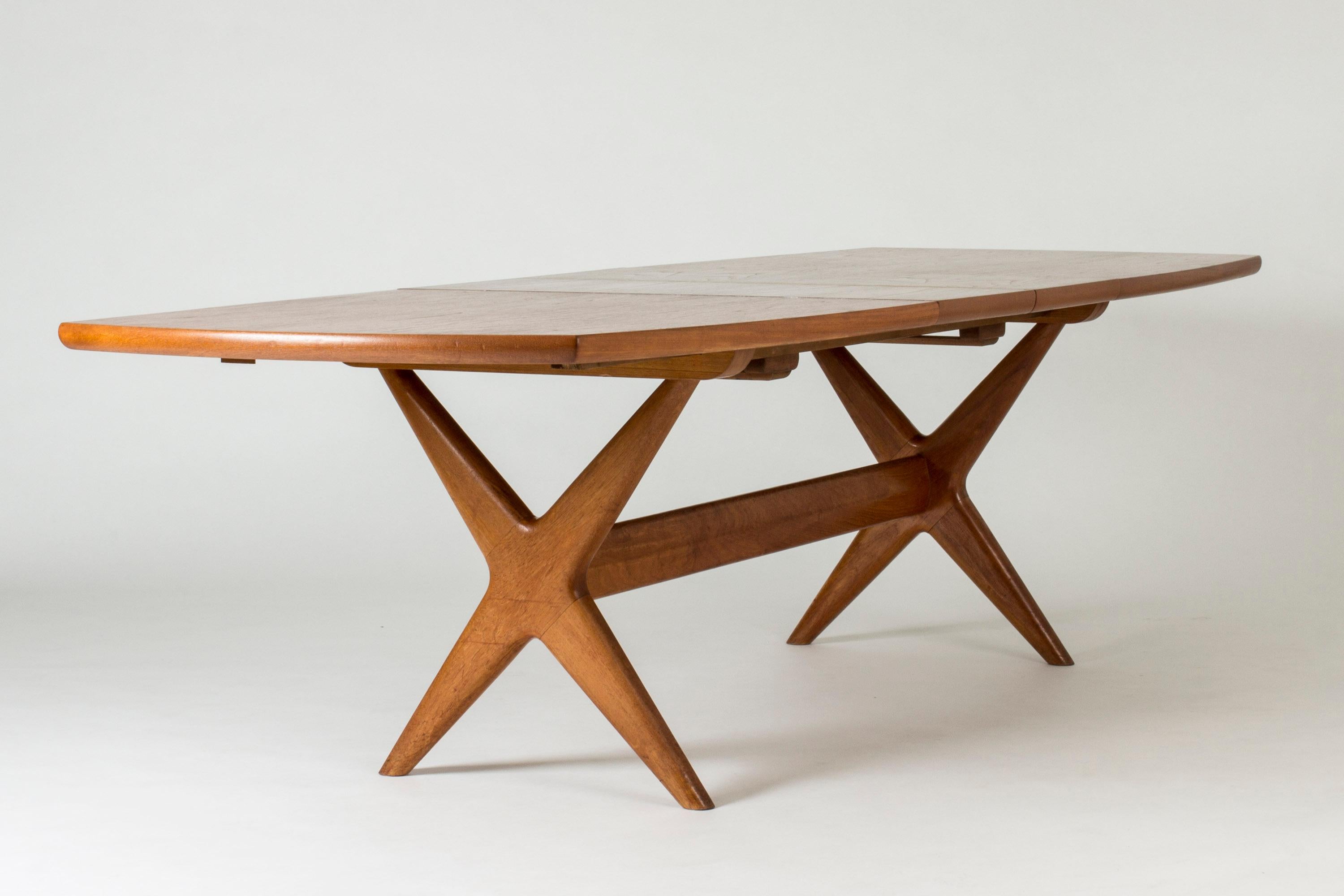 Amazing “Captain’s” dining table by Fredrik Kayser, made from teak. Two extra leaves stored cleverly inside the table. Cool chunky design with streamlined curves.

Size: Height 71.5 cm, width 190 + 35 + 35 cm (total length with leaves 260 cm),