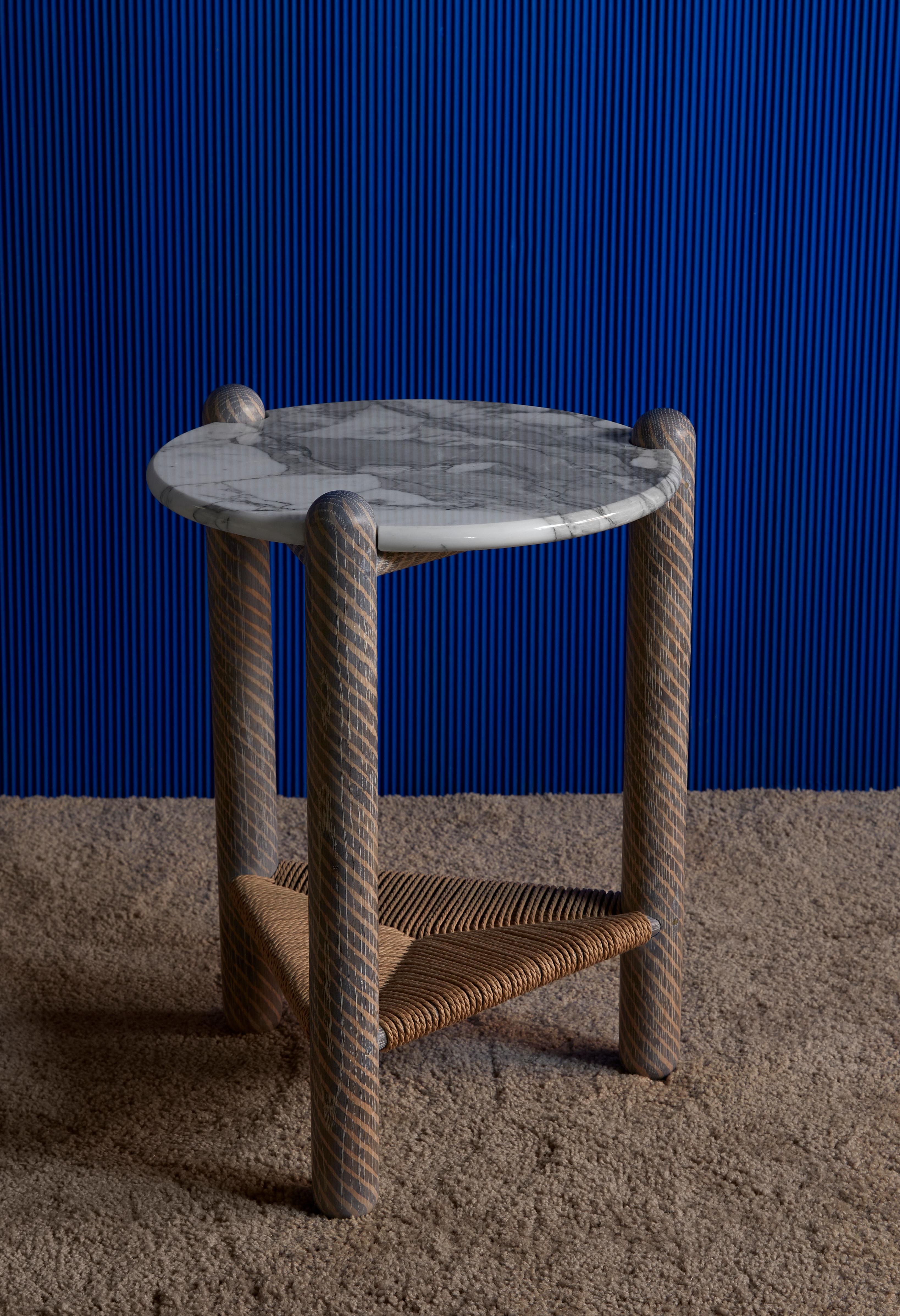 Captain's side table by Hamilton Holmes
Oxalino Collection 
2020
Dimensions: D 38.1 W 38.1 H 50.8 cm
Materials : White Oak, Calcatta marble, Natural Danish Cord, Oxidized Treatment

These solid Oak three legged tables feature handwoven Danish