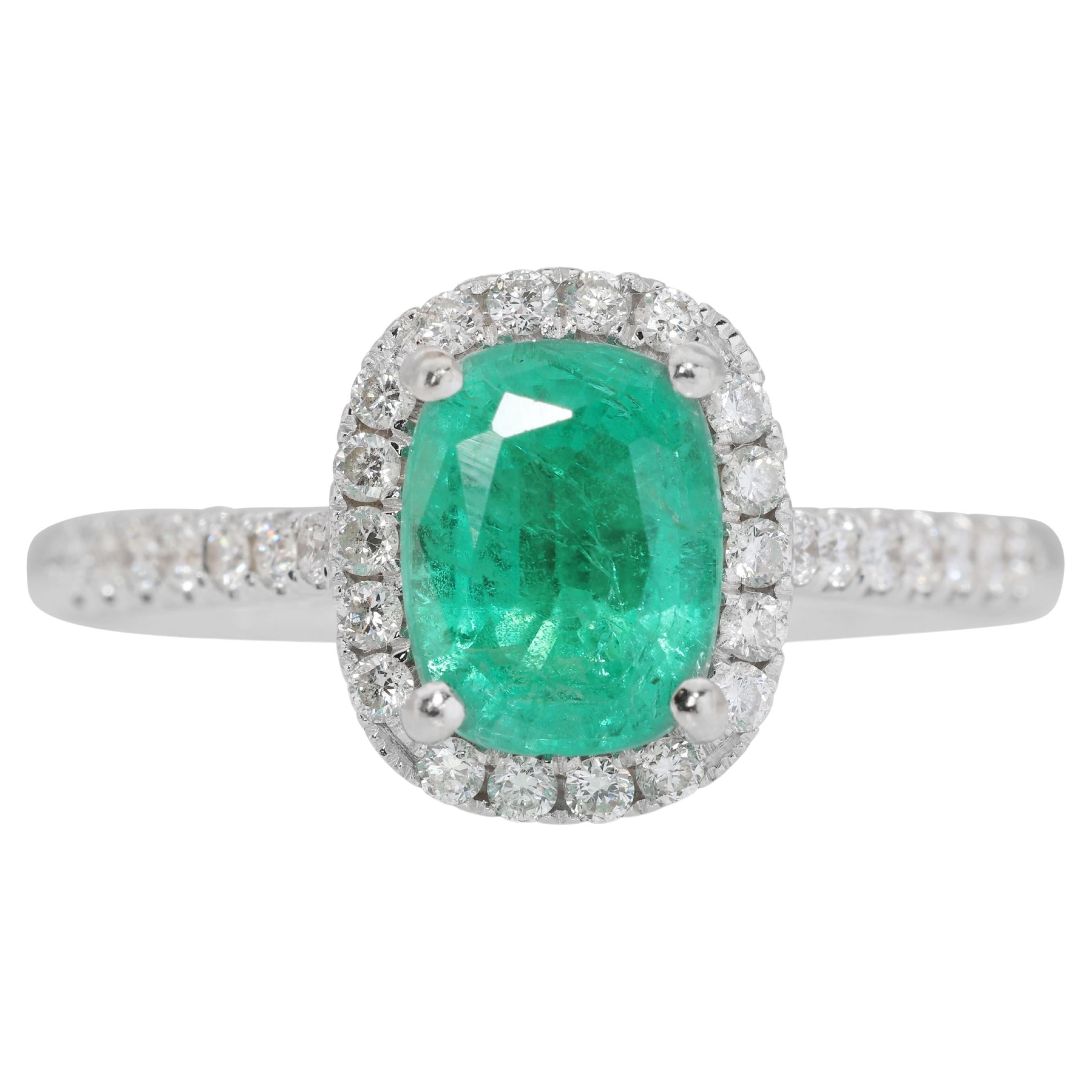 Captivating 0.69ct Emerald Ring with 0.29ct Diamond Side Stones For Sale