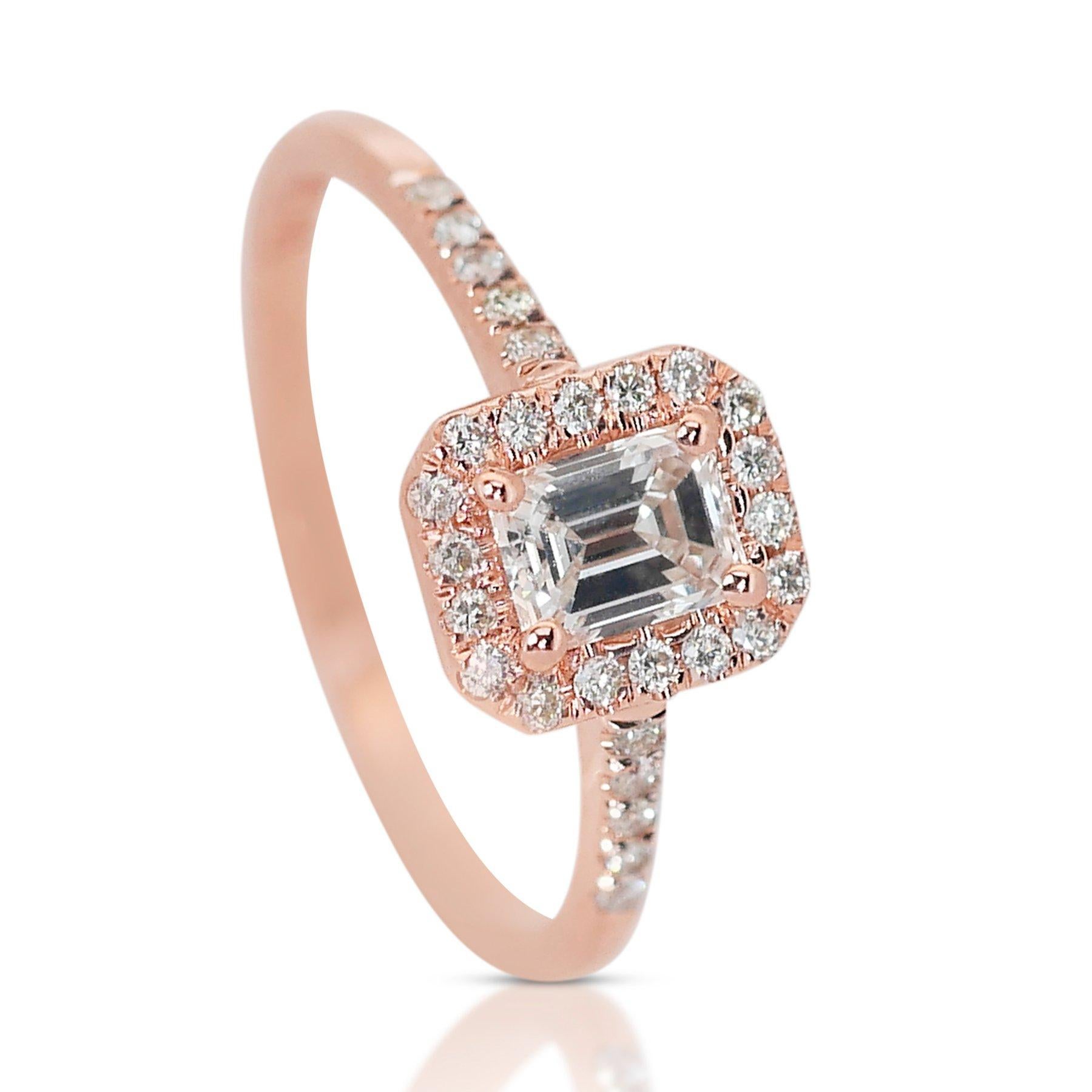 Captivating 0.90ct Diamonds Halo Ring in 18k Rose Gold - GIA Certified 

Introducing this diamond halo ring, a delicate yet striking creation that exudes timeless elegance. This ring features an emerald-cut main diamond weighing 0.70 carats, set in