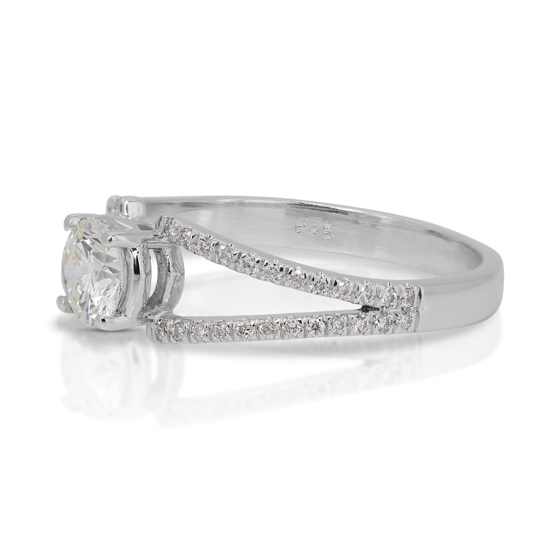 Captivating 0.92ct Triple Excellent Ideal Cut Diamonds Pave Ring in 18k White Gold - GIA Certified

Elevate your style with this dazzling ring, featuring a 0.70-carat round diamond as its centerpiece, highlighted by its triple excellent ideal cut.
