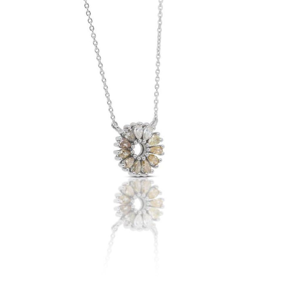 This captivating necklace boasts a remarkable 1.01 carat pear brilliant-cut diamond as its centerpiece, exuding a mesmerizing blend of natural fancy yellow to natural fancy intense brownish-yellow hues. The main stone, with its unique and enchanting