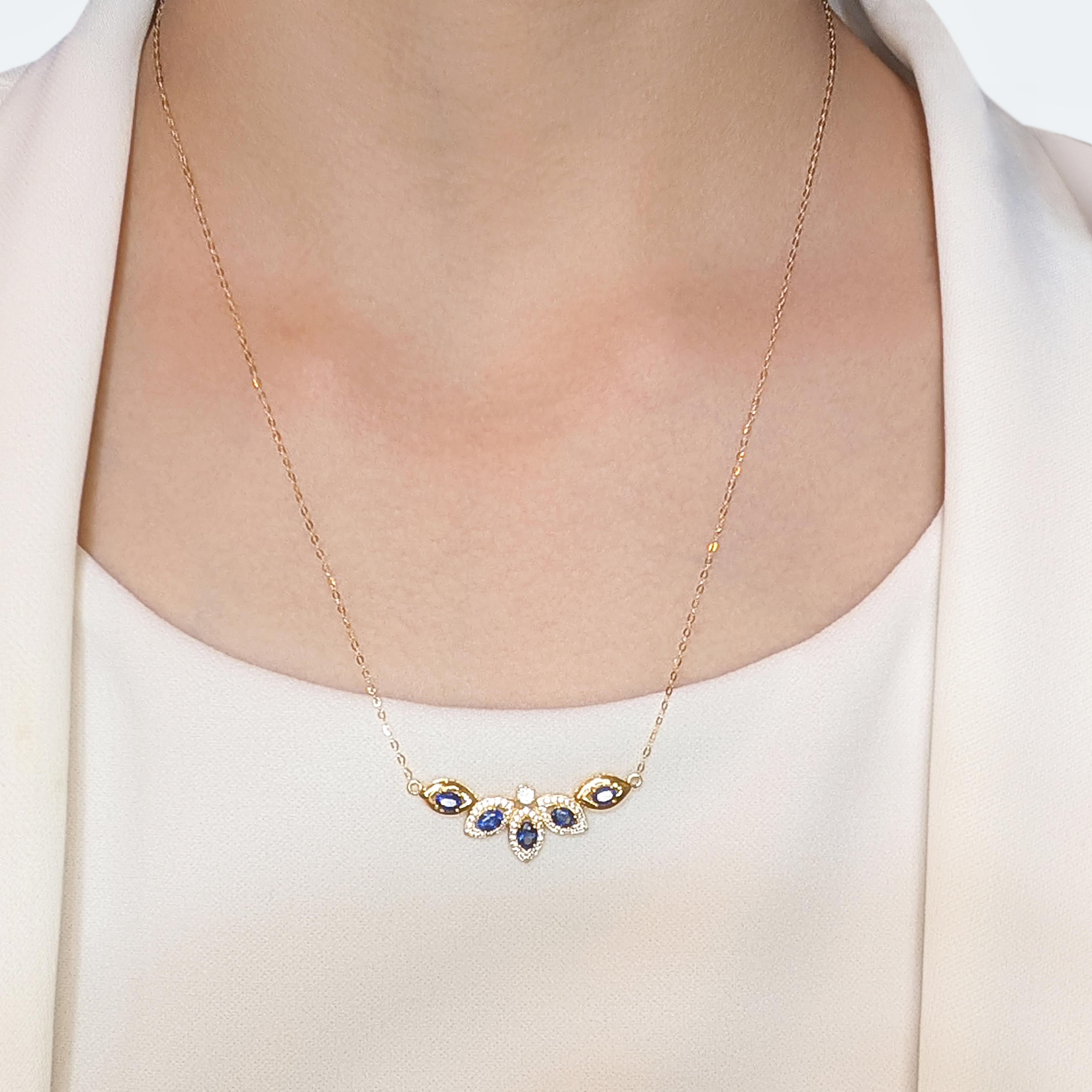 This elegant necklace, crafted in luxurious 18K yellow gold, features a striking design that radiates timeless beauty. The centerpiece boasts 5 oval-cut blue sapphires with a combined weight of 0.75ct, exuding a regal and captivating charm. Adding
