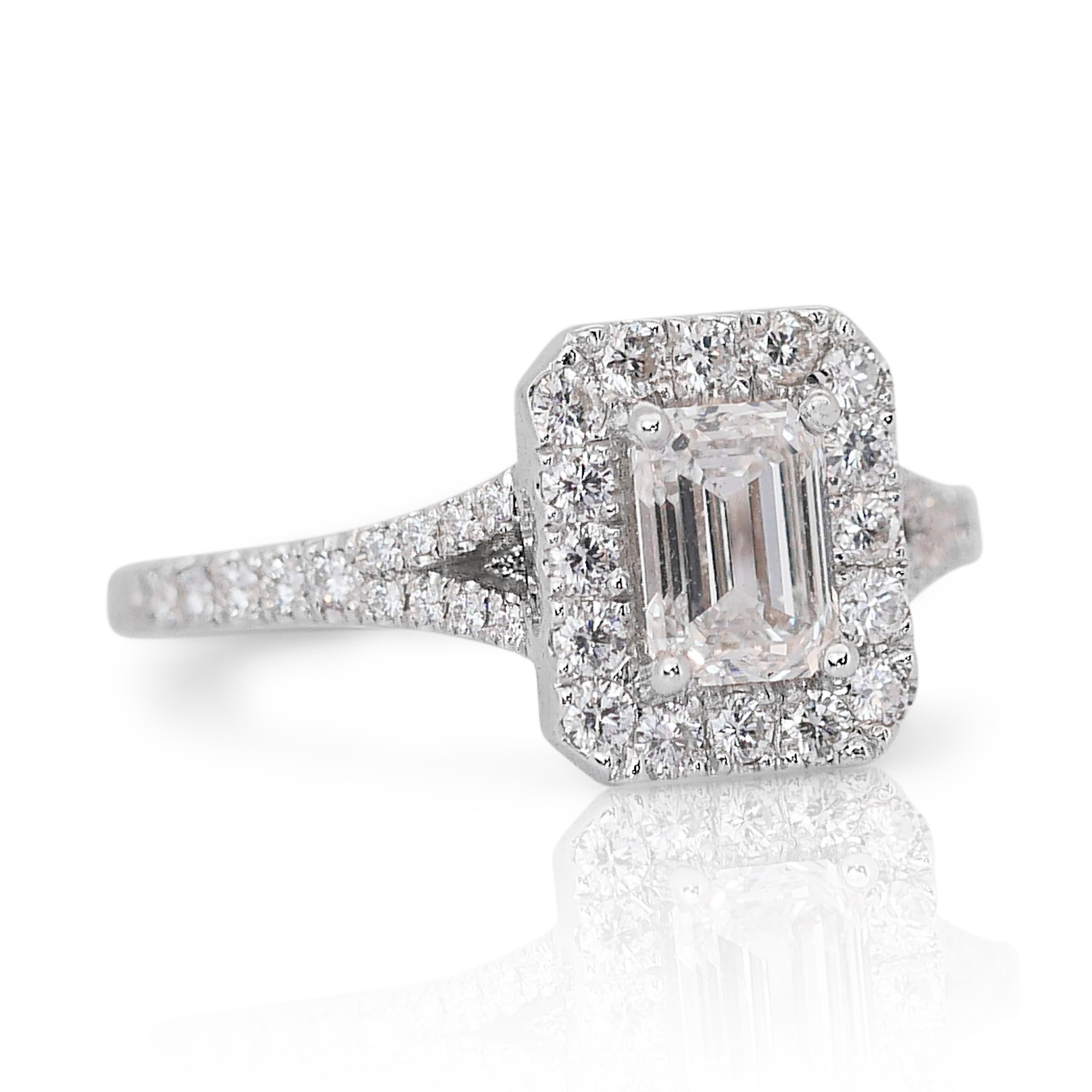 Captivating 1.15ct Emerald-Cut Diamond Halo Ring in 18k White Gold - GIA Certified 

This exquisite diamond halo ring in 18k white gold is a perfect blend of modern elegance and timeless design. It features a central emerald-cut diamond weighing