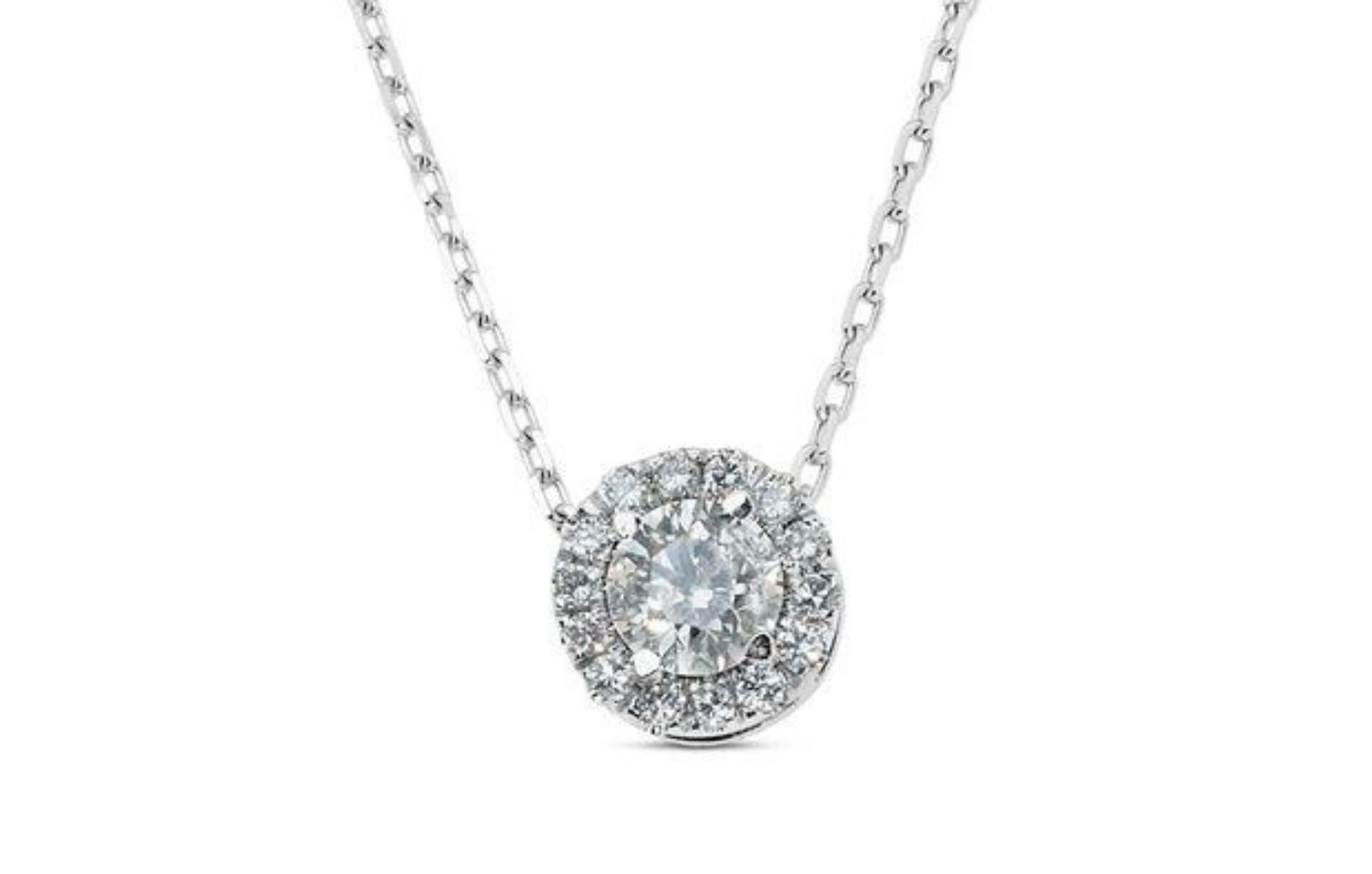 Captivate with Elegance: 1.15 Carat Round Brilliant Diamond Necklace. Own a piece of timeless elegance with this captivating diamond necklace, featuring a mesmerizing 0.7 carat round brilliant natural diamond centerpiece. Surrounded by a halo of