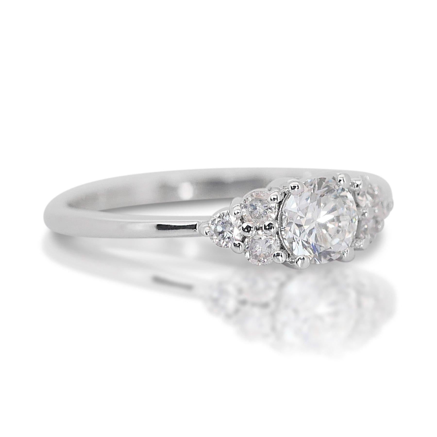 Captivating 1.25ct Diamonds 7-Stone Ring in 18k White Gold - GIA Certified

This elegant 7-stone ring, expertly crafted from 18k white gold, features a stunning 1.00-carat main diamond with an exceptional color grade. Complementing the central
