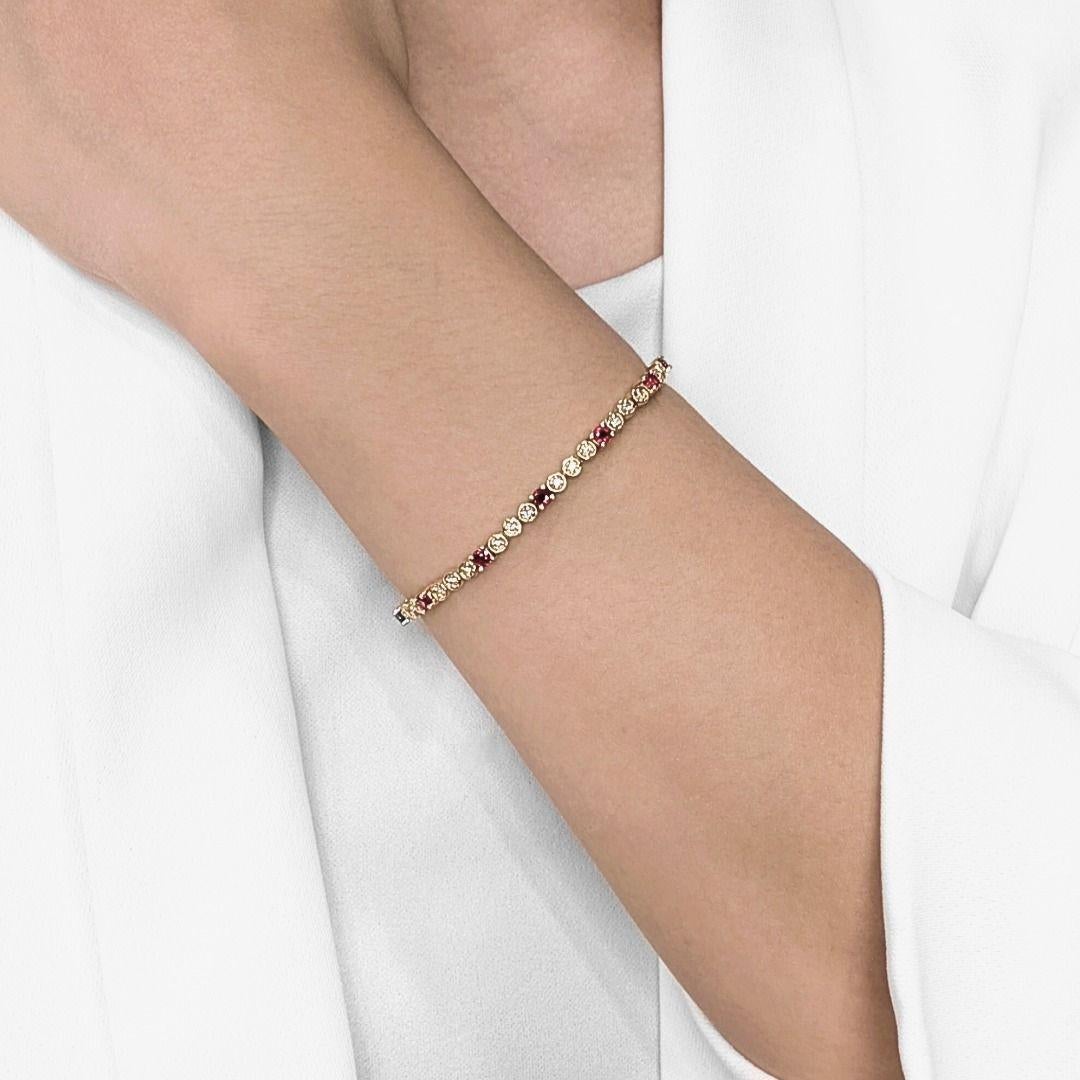 This eye-catching bracelet brings together fiery rubies and dazzling diamonds in a timeless tennis design that’s impossible to ignore. Crafted in luxurious 18K yellow gold, it features 12 vivid round brilliant rubies totaling 1.08 carats,