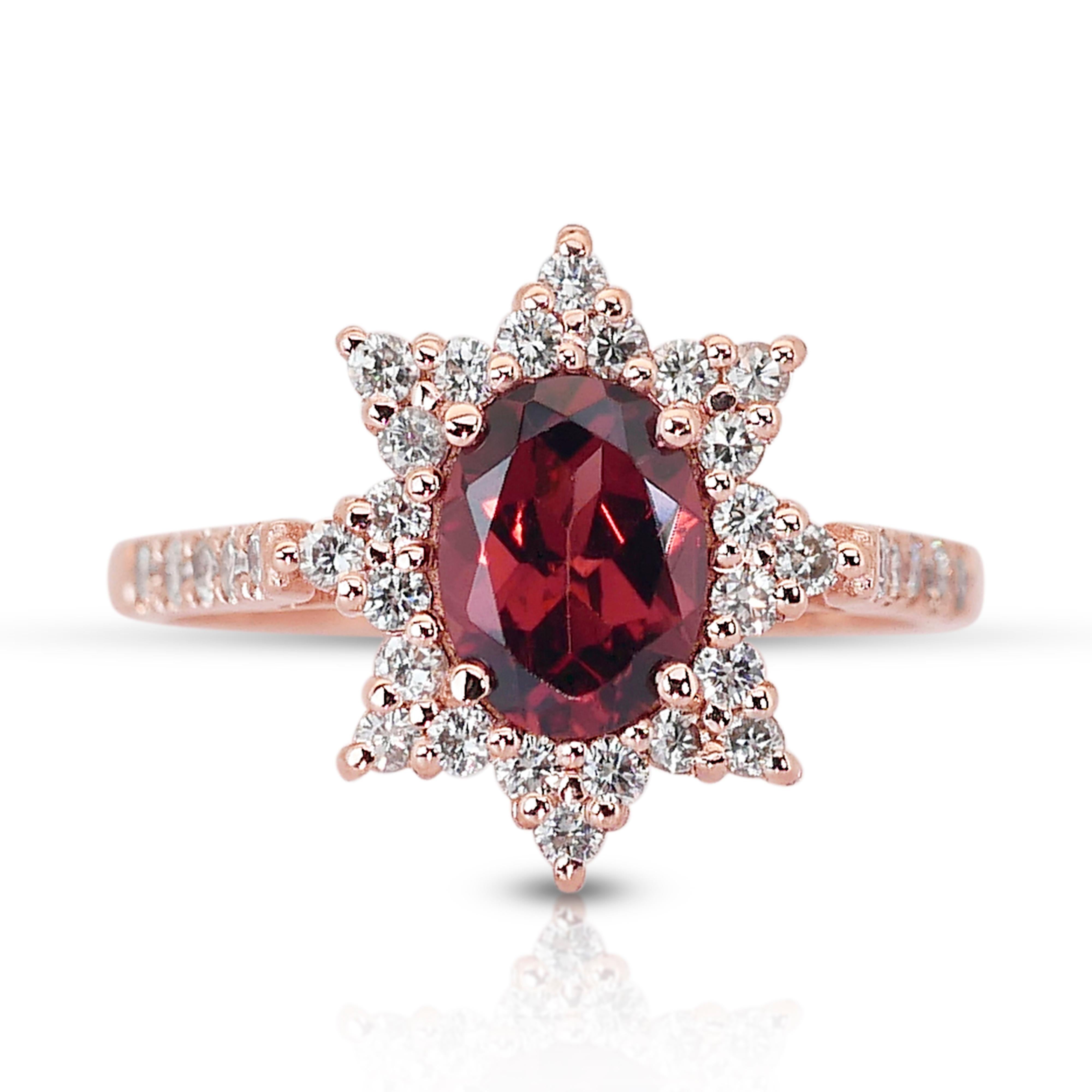 Captivating 14k Rose Gold Garnet and Diamond Halo Ring w/1.87 ct - IGI Certified

This 14k rose gold halo ring stands as a testament to timeless elegance, featuring a magnificent 1.35 carat oval garnet at its center. The main stone captivates with