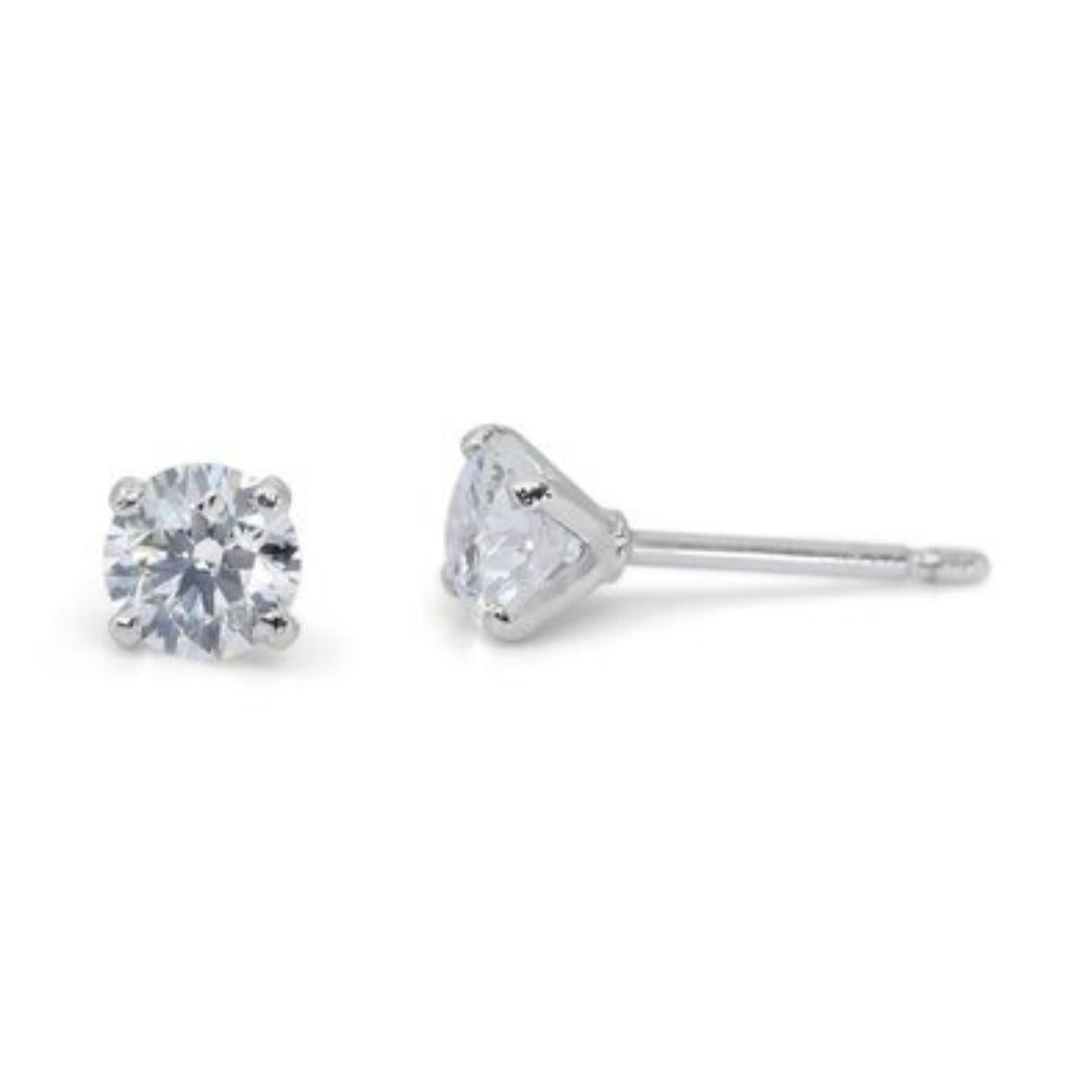 Unleash the brilliance with these mesmerizing 1.8 carat diamond stud earrings, crafted in gleaming 18K white gold for a timeless design. Each earring features a breathtaking Round Brilliant diamond, boasting exceptional D color (highest color