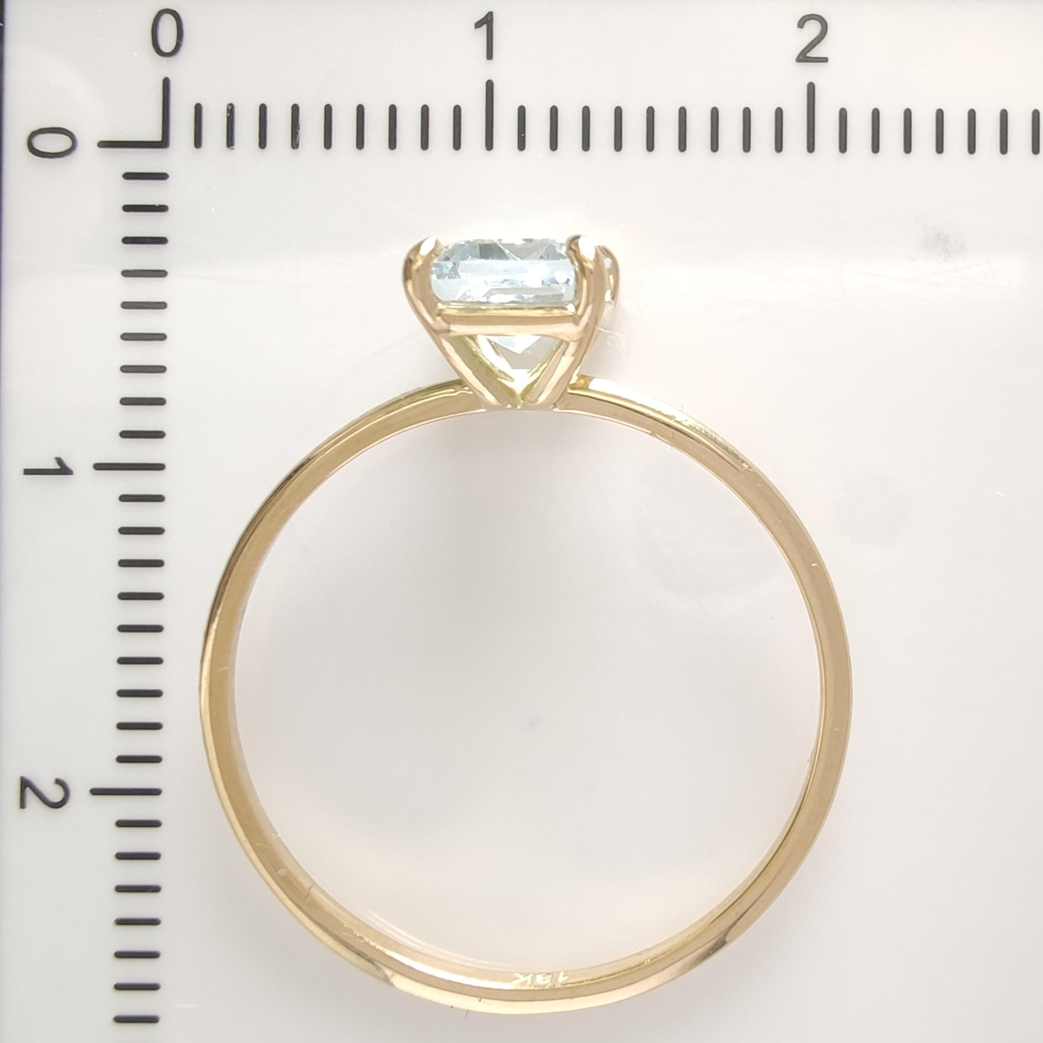 Captivating 18K Gold Solitaire Ring featuring a 0.83 Ct. Emerald-Cut Aquamarine For Sale 7