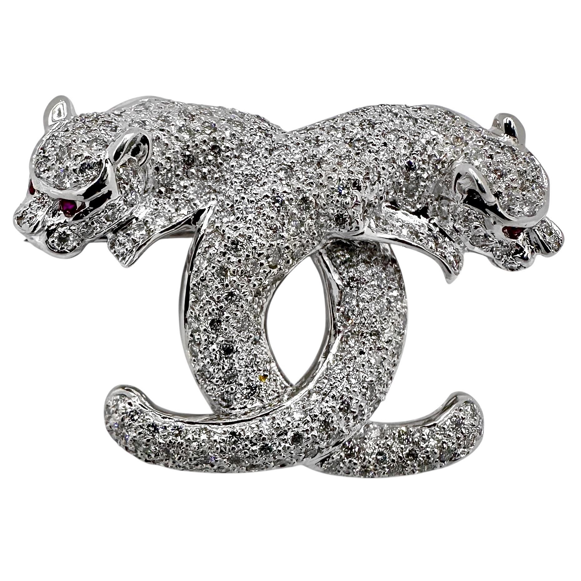 Captivating 18K White Gold Diamond Encrusted Double Cat Brooch with Ruby Eyes