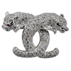 Captivating 18K White Gold Diamond Encrusted Double Cat Brooch with Ruby Eyes