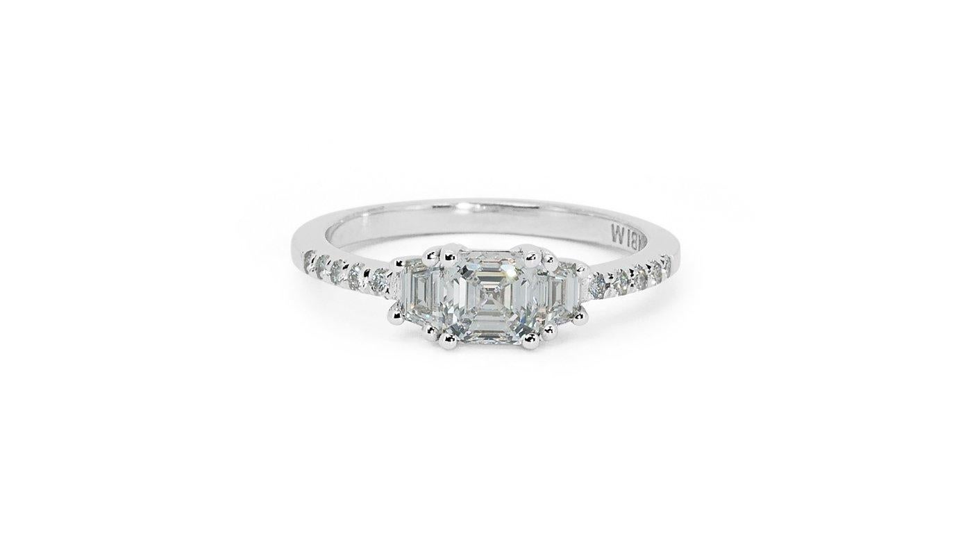 A captivating ring with a dazzling 0.7 carat square emerald cut natural diamond. It has 0.36 carat of side diamonds which add more to its elegance. The jewelry is made of 18k white gold with a high quality polish. It comes with GIA certificate and a