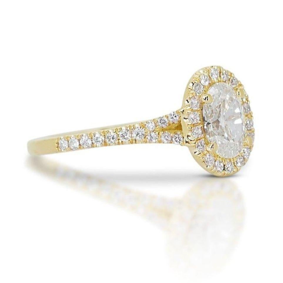 At its heart, a dazzling 0.7 carat oval diamond shimmers with the captivating beauty of sunlight dancing on leaves. The exquisite oval cut ignites an endless play of light and fire, showcasing a breathtaking G-H color and VS1-VS2 clarity. Each