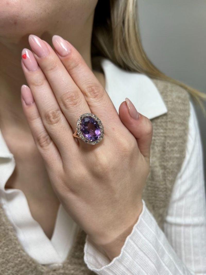 
Enhancing the allure of the ring are twenty-two round brilliant-cut diamond side stones, totaling 1.35 carats. Graded H-I in color and SI2-I1 in clarity, these diamonds offer a subtle contrast to the vibrant amethyst, adding sparkle and brilliance
