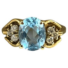 Accattivante anello con topazio blu e diamanti in oro giallo 10K, misura 6
