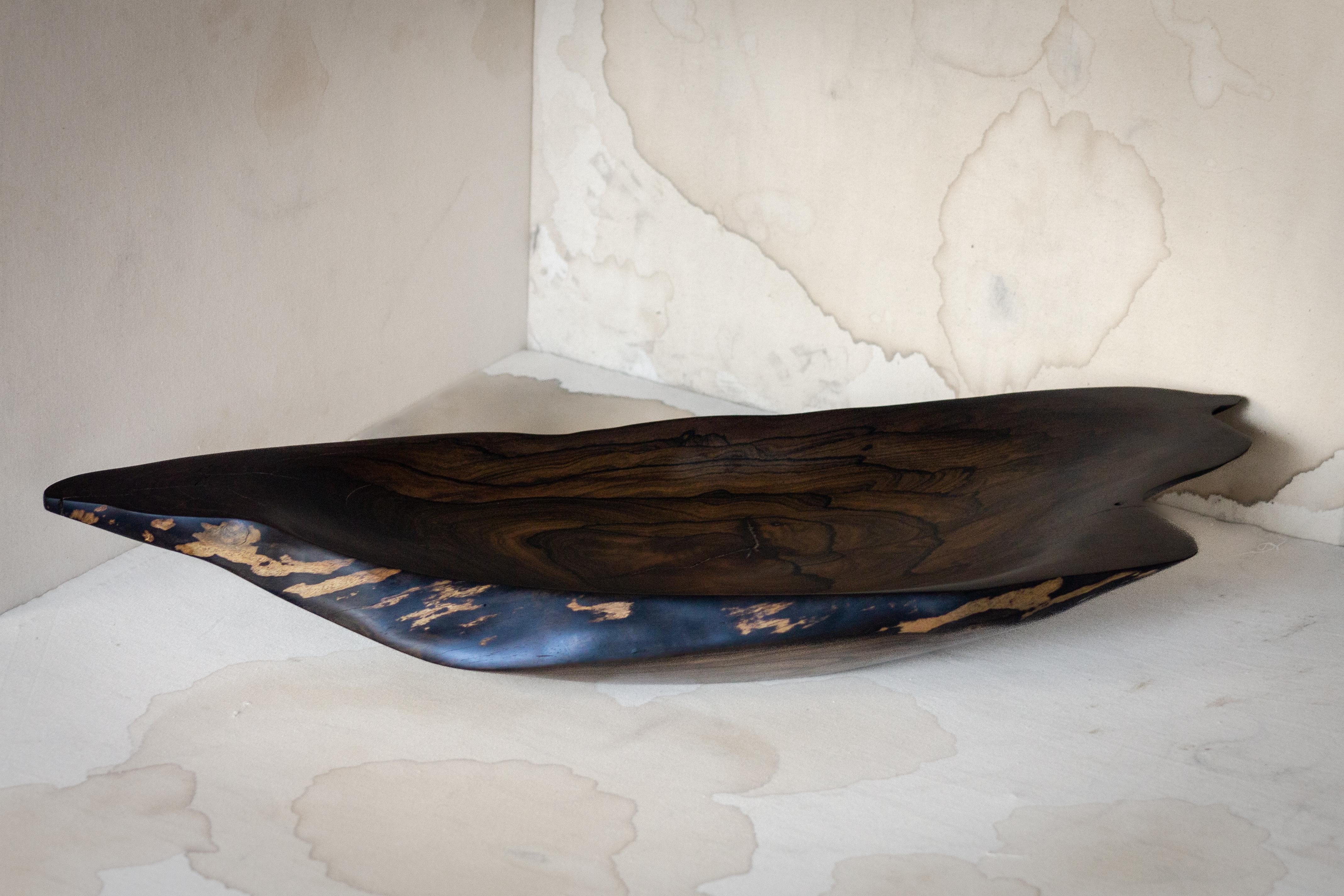 Discover the allure of history reborn with our Salvaged Ziricote Raft Centerpiece, a remarkable fusion of nature's narrative and artisanal craftsmanship. This piece, crafted from rescued Ziricote wood found in the heart of the Mayan jungle,