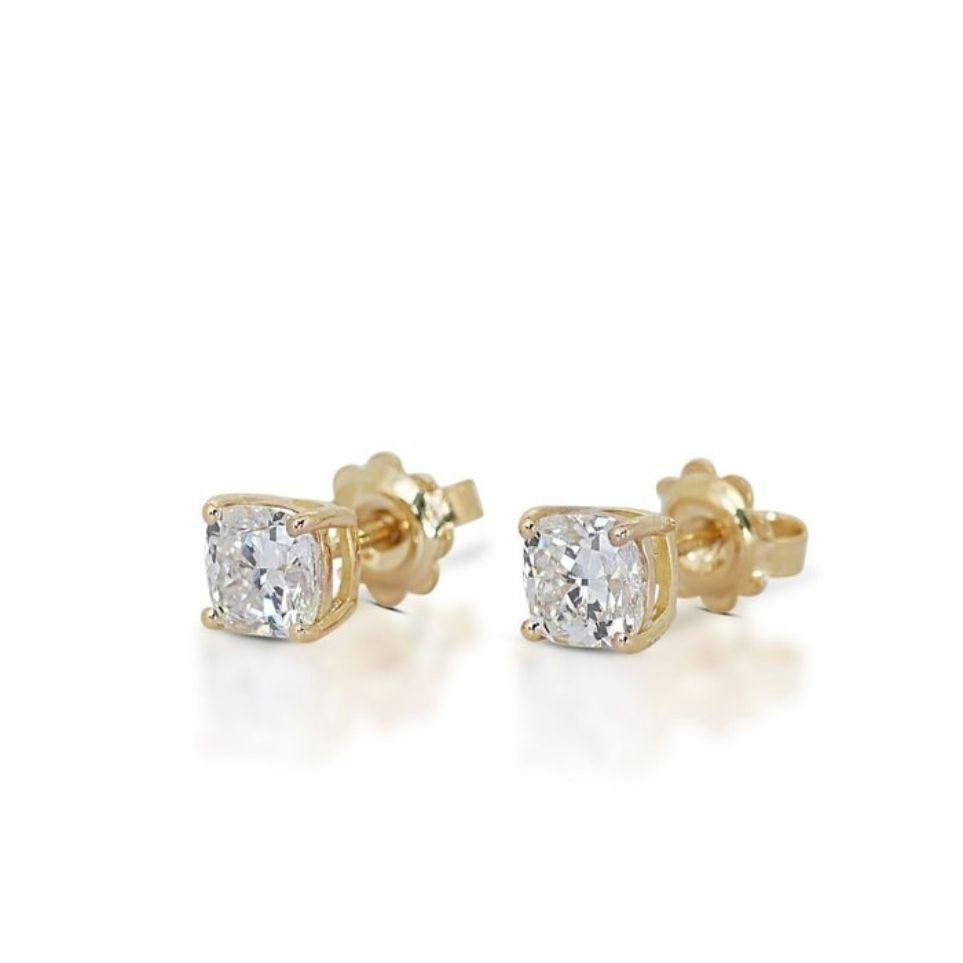 Embrace timeless elegance with these mesmerizing earrings, featuring a dazzling 2.01 carat total weight of F-G color, VS1 clarity, EX cut cushion diamonds. Set in gleaming 18K yellow gold, meticulously polished for exceptional shine, these earrings