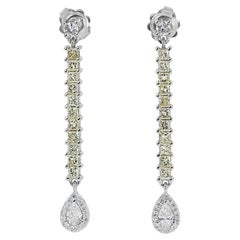 Captivating Pair of Earrings with 0.38 carat Pear shape natural diamonds