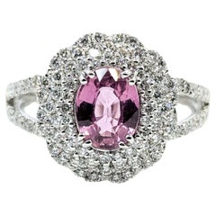 Fesselnder Ring aus Platin mit pinkem Saphir und Diamant in Doppelringform