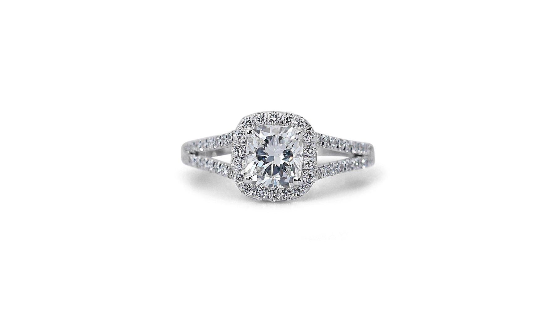 This captivating ring features a dazzling 1.01 carat cushion cut natural diamond, showcasing a captivating G-H color and VS2 clarity that exudes elegance and sophistication. The diamond's VG cut grade ensures exceptional sparkle and brilliance,