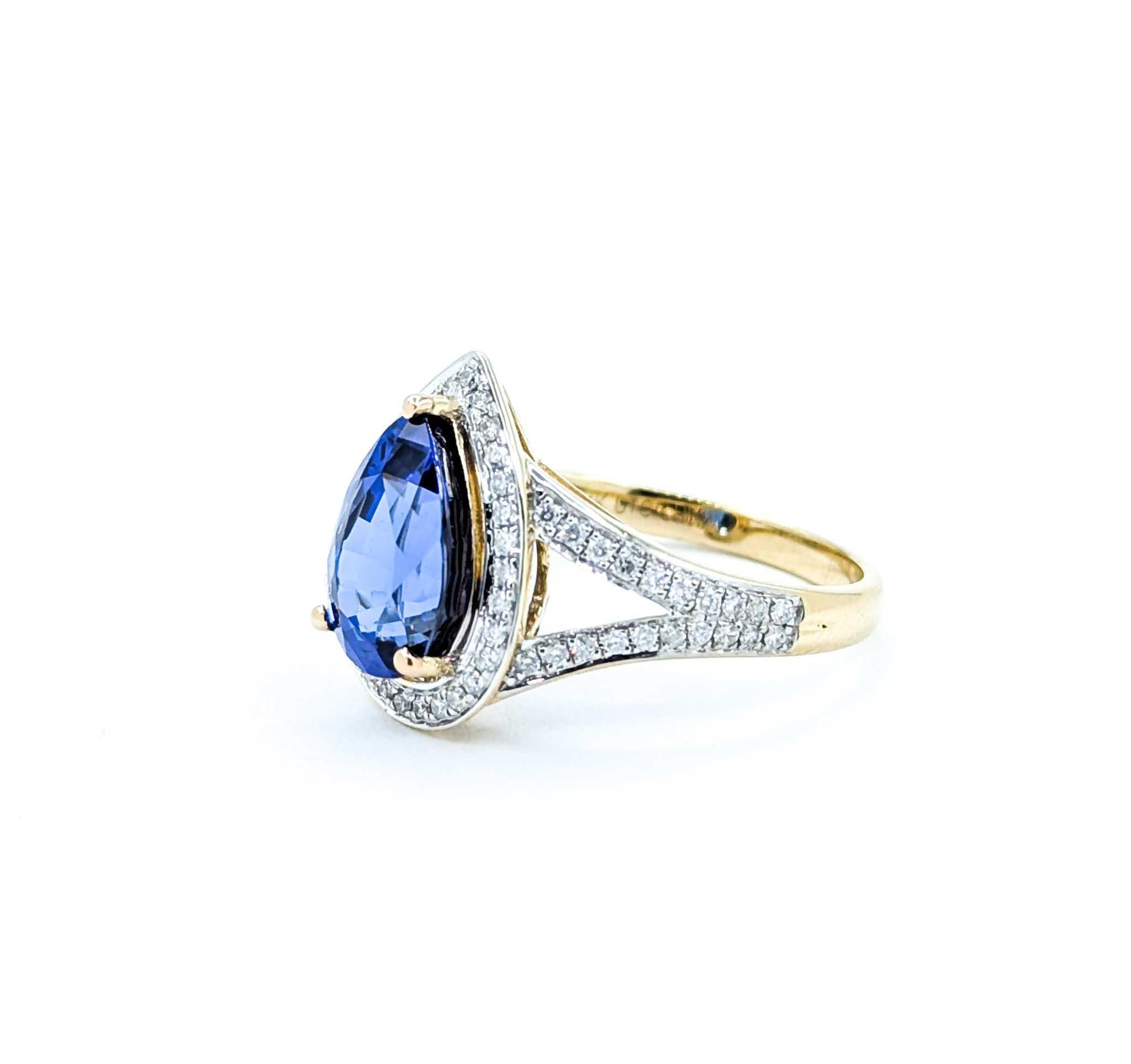 Captivating Tanzanite & Diamond Halo Ring in 14k Yellow Gold For Sale 4
