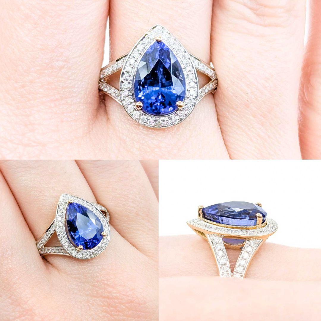 Captivating Tanzanite & Diamond Halo Ring in 14k Yellow Gold
This captivating Tanzanite and Diamond Halo Ring is crafted in 14k yellow gold and features a striking 4.75ct blue tanzanite. Surrounded by a shimmering halo of 0.35ctw diamonds, the vivid