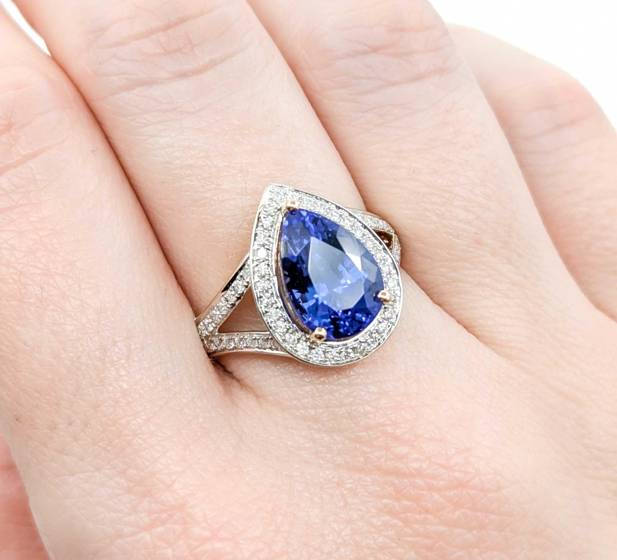 Pear Cut Captivating Tanzanite & Diamond Halo Ring in 14k Yellow Gold For Sale