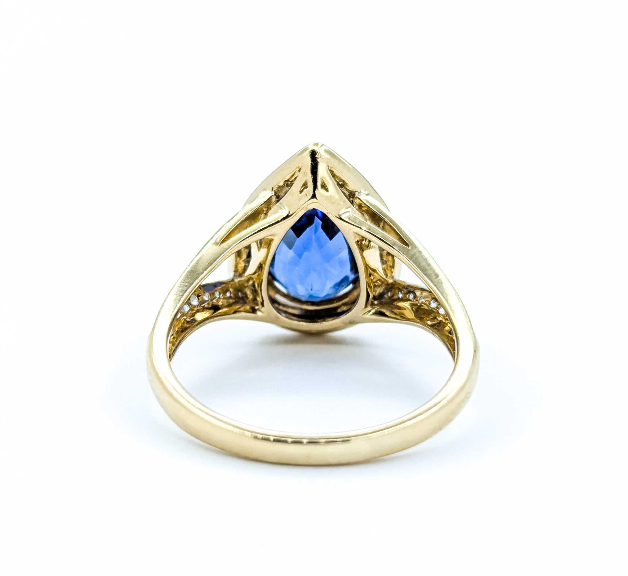 Captivating Tanzanite & Diamond Halo Ring in 14k Yellow Gold For Sale 1