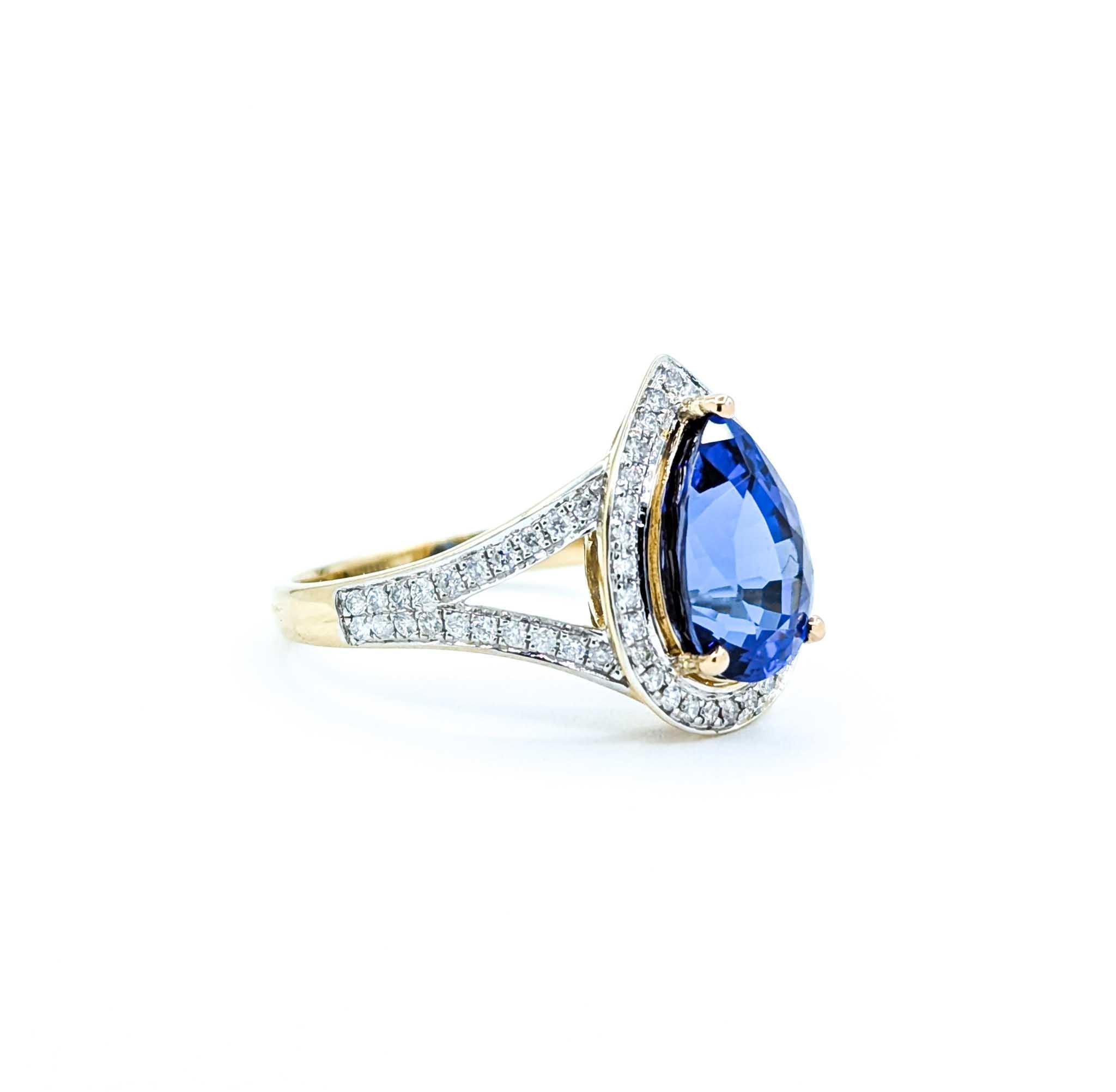Captivating Tanzanite & Diamond Halo Ring in 14k Yellow Gold For Sale 2