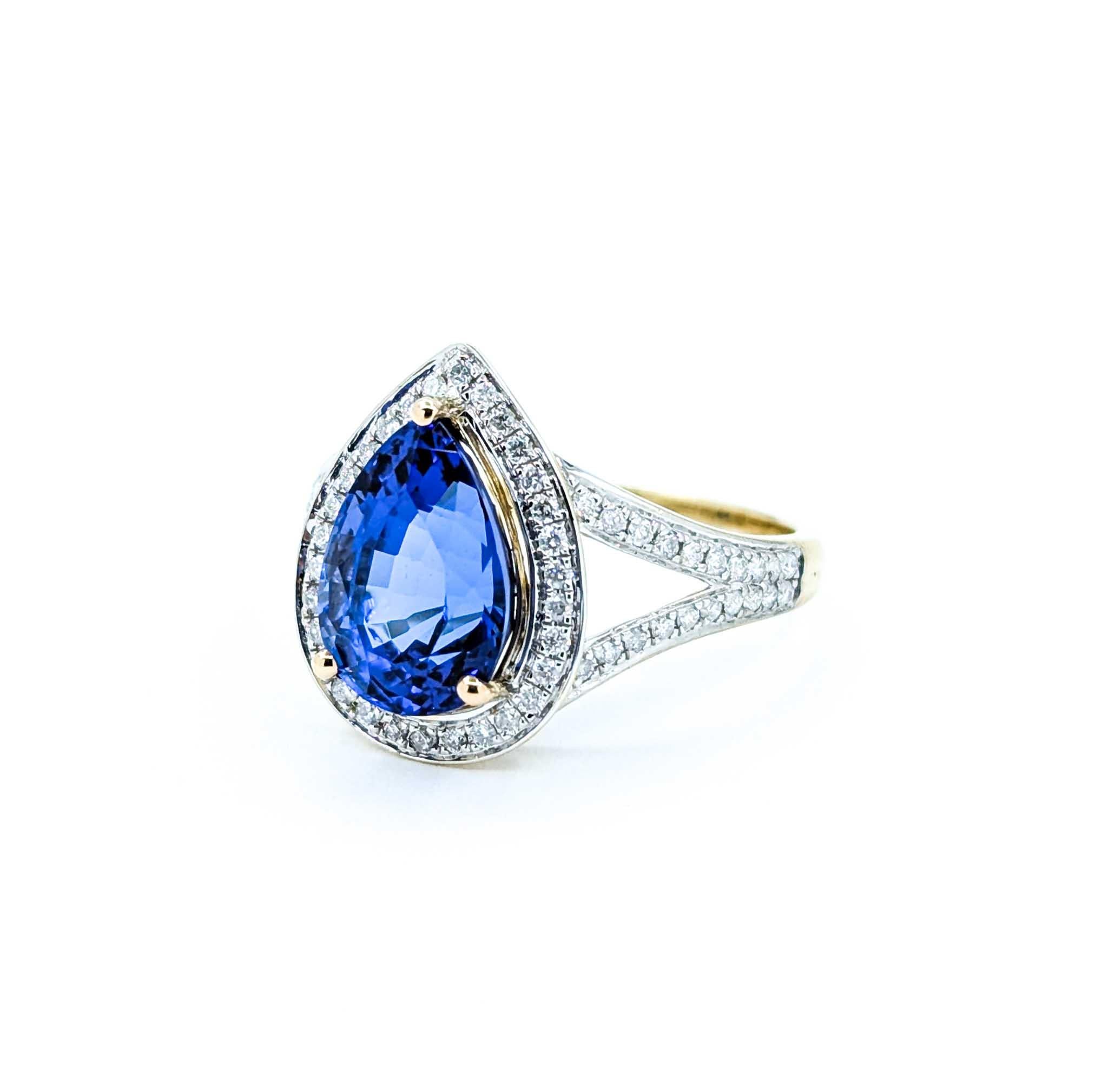 Captivating Tanzanite & Diamond Halo Ring in 14k Yellow Gold For Sale 3