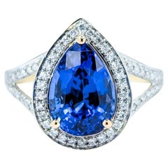 Bezaubernder Tansanit & Diamant-Halo-Ring aus 14 Karat Gelbgold