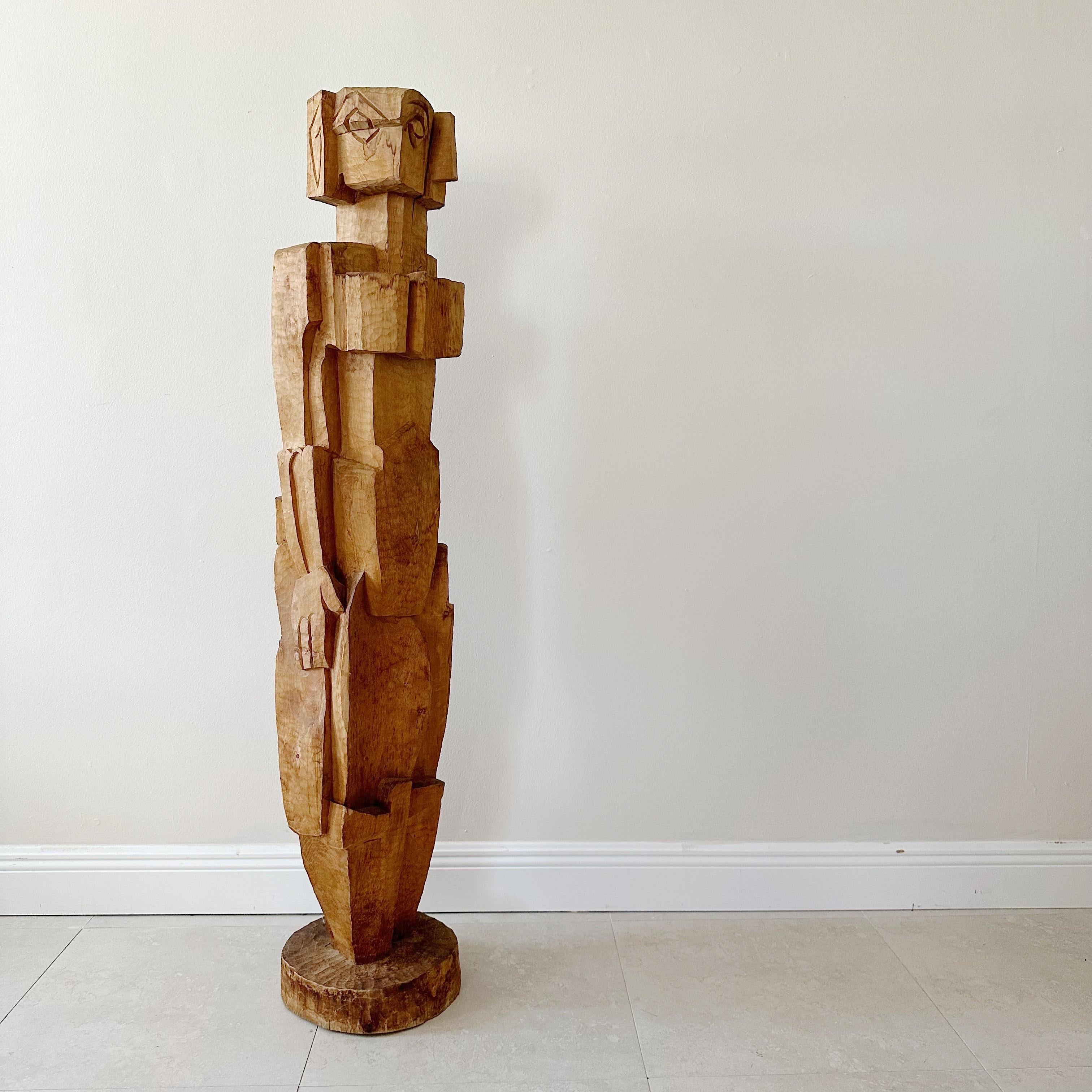 This vintage figural cubist wood sculpture is a striking and unique piece of mid-century artwork. The sculpture features a stylized figure that is carved from high-quality wood and embodies the principles of cubism.

The design of the sculpture is