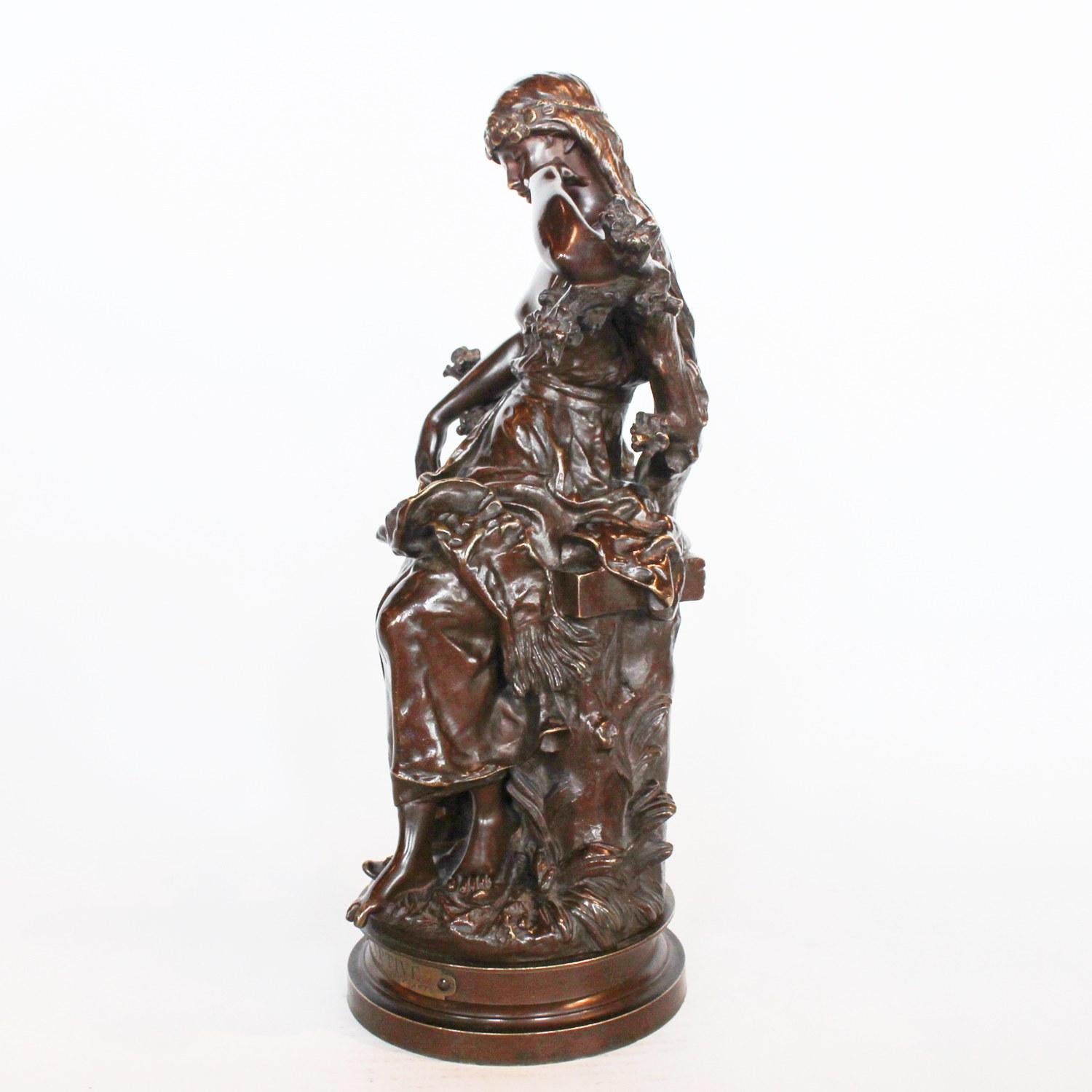 Captive, an Art Nouveau rich brown patinated bronze figure of a scantily clad young lady. Signed Hip Moreau to cast, and with title plaque to front.



