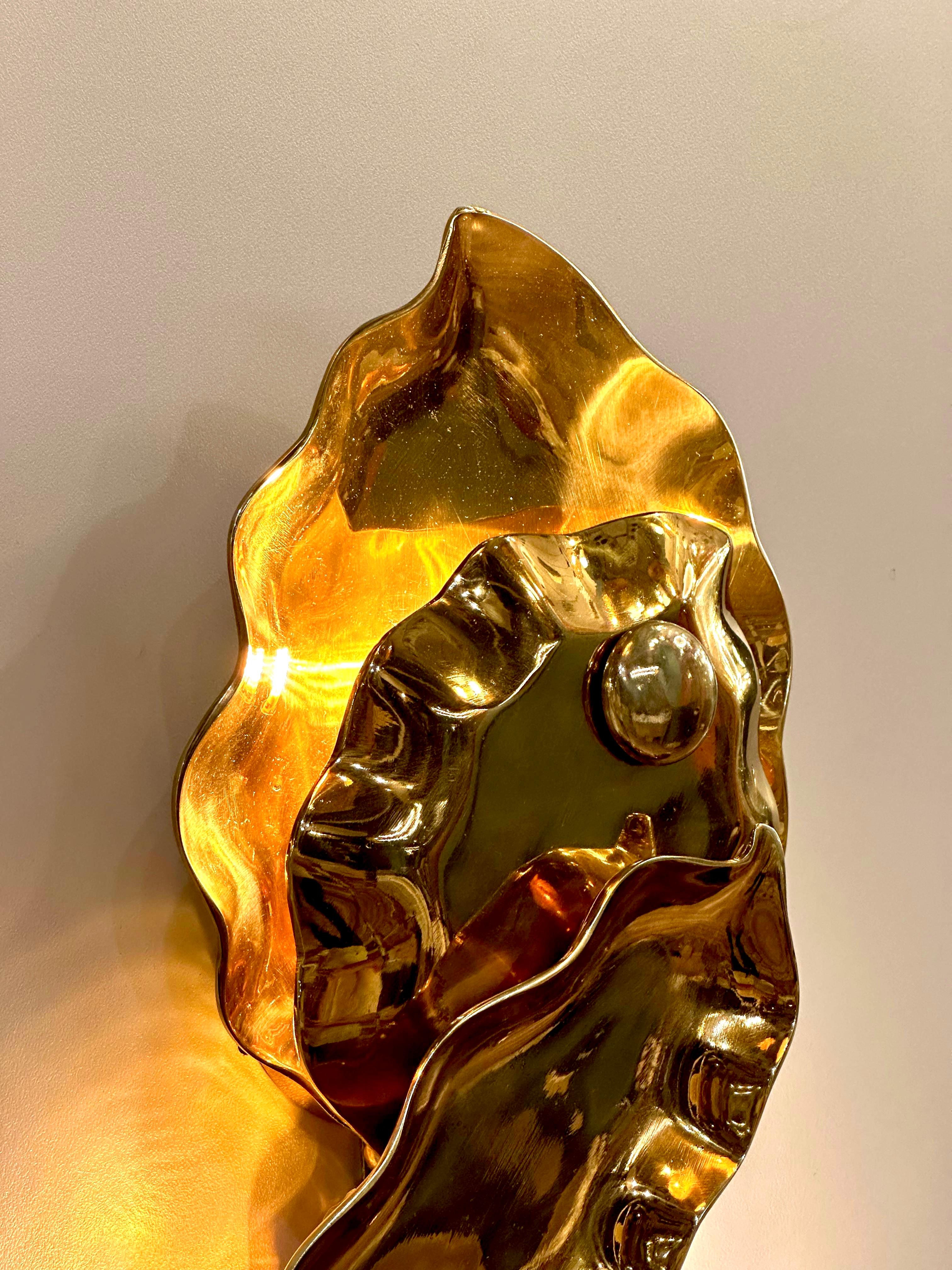 CAPUA Brass Wall Sconce, a luminary masterpiece that transcends the ordinary, casting an enchanting glow while artfully mimicking the organic beauty of nature. Illuminating with not just light but with a touch of elegance, this sconce is designed to