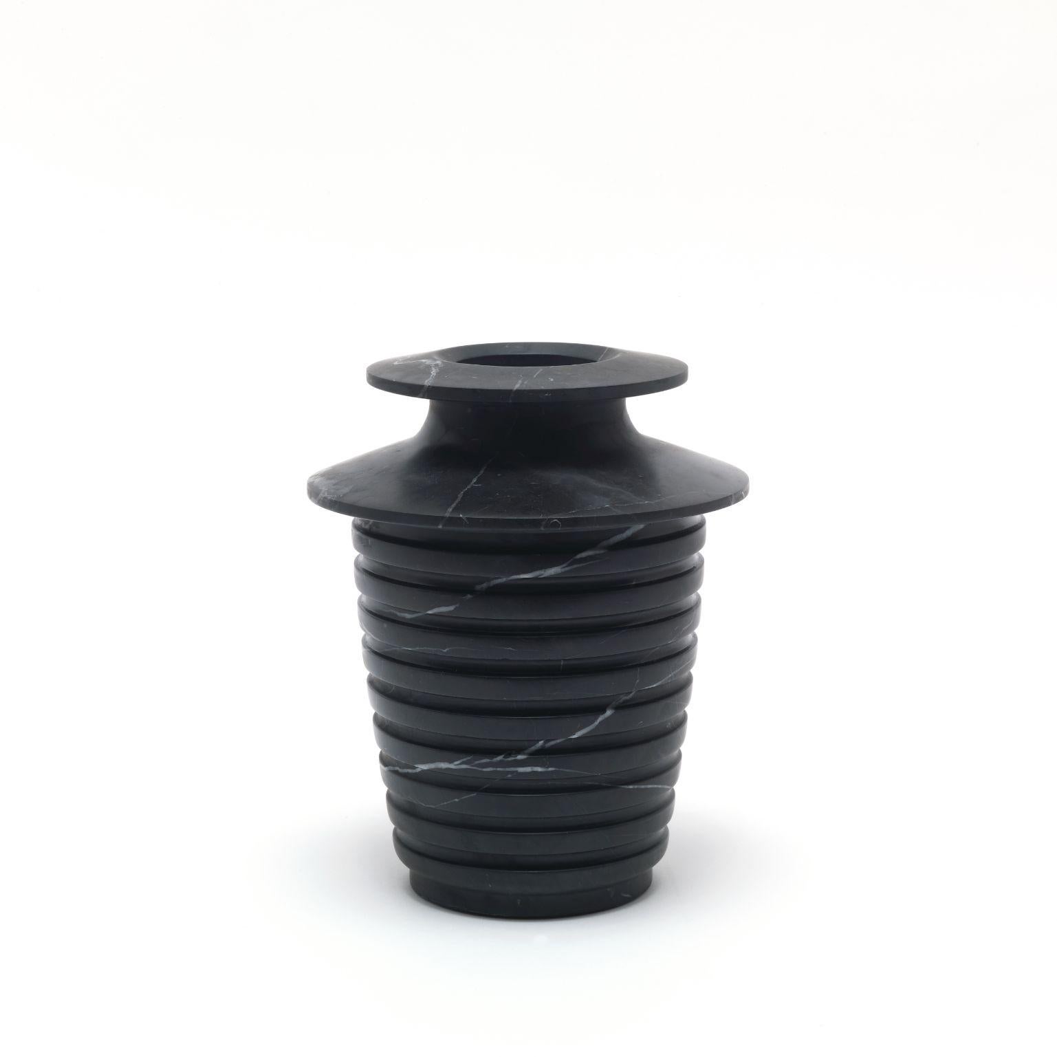 Capua medium vase by Ivan Colominas
Capua Collection
Dimensions: 19 x 23.5 cm
Materials: Nero marquinia

Also available: Large

A vase that’s an homage to design and to marble itself: the Marquinia veins look skyward, toward the crater
