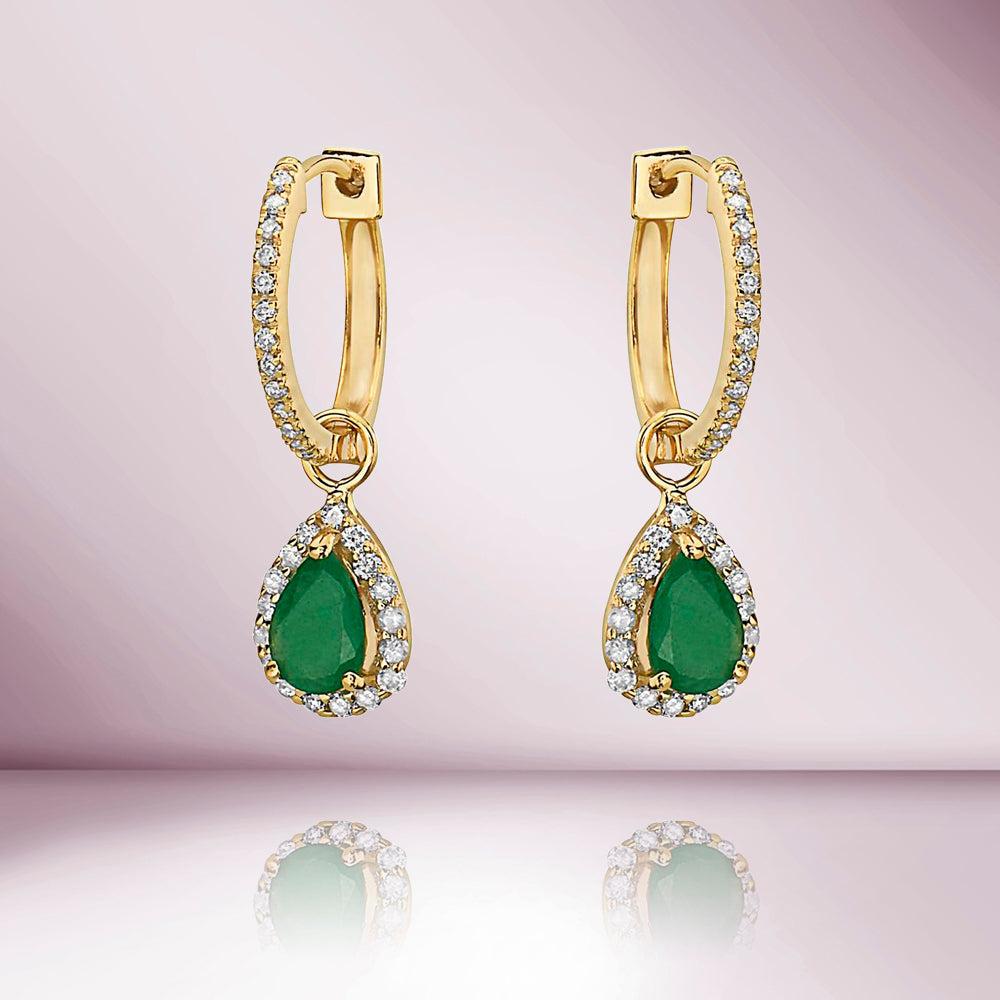These Emerald Pear Shape earrings are perfect for daily wear, anniversaries, weddings, engagements, parties, ceremonies, and cocktails features shimmering round shaped diamonds arranged elegantly in a classic prong setting on the inner and outer