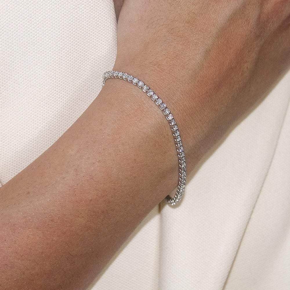 Description
Beautiful Diamond Tennis Bracelet. A staple in your jewelry collection. Handmade in New York City. This tennis Bracelet showcases a delicate box chain embellished with dozens of shimmering white diamonds. Quality to us is important and