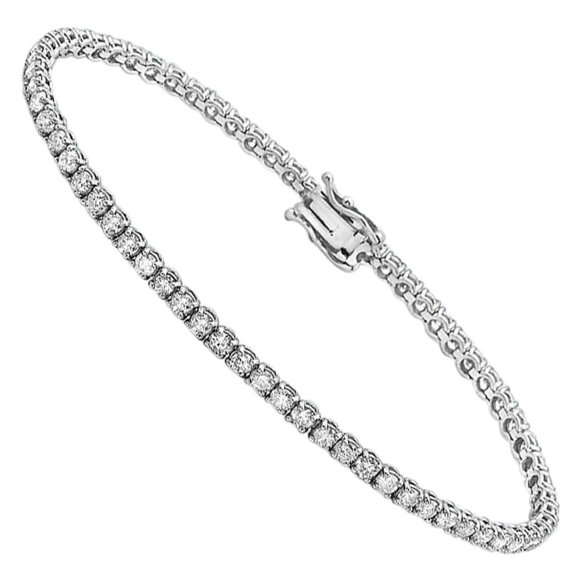 Capucelli 3,86 carats. Bracelet tennis « T.W. » à 4 griffes en or 14 carats et diamants naturels