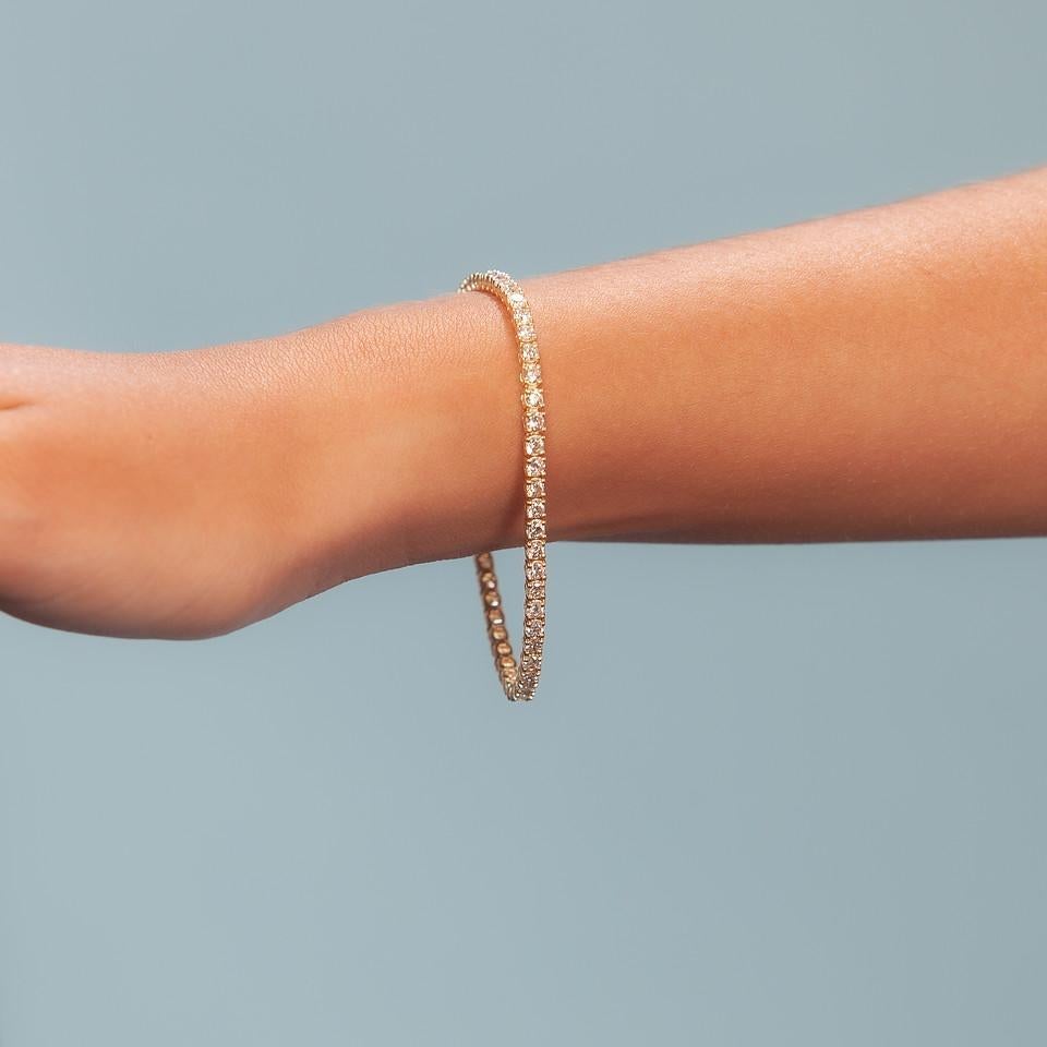 Beautiful Diamond Tennis Bracelet. A staple in your jewelry collection. Handmade in New York City . This tennis Bracelet showcases a delicate box chain embellished with dozens of shimmering white diamonds. Quality to us is important and that is why