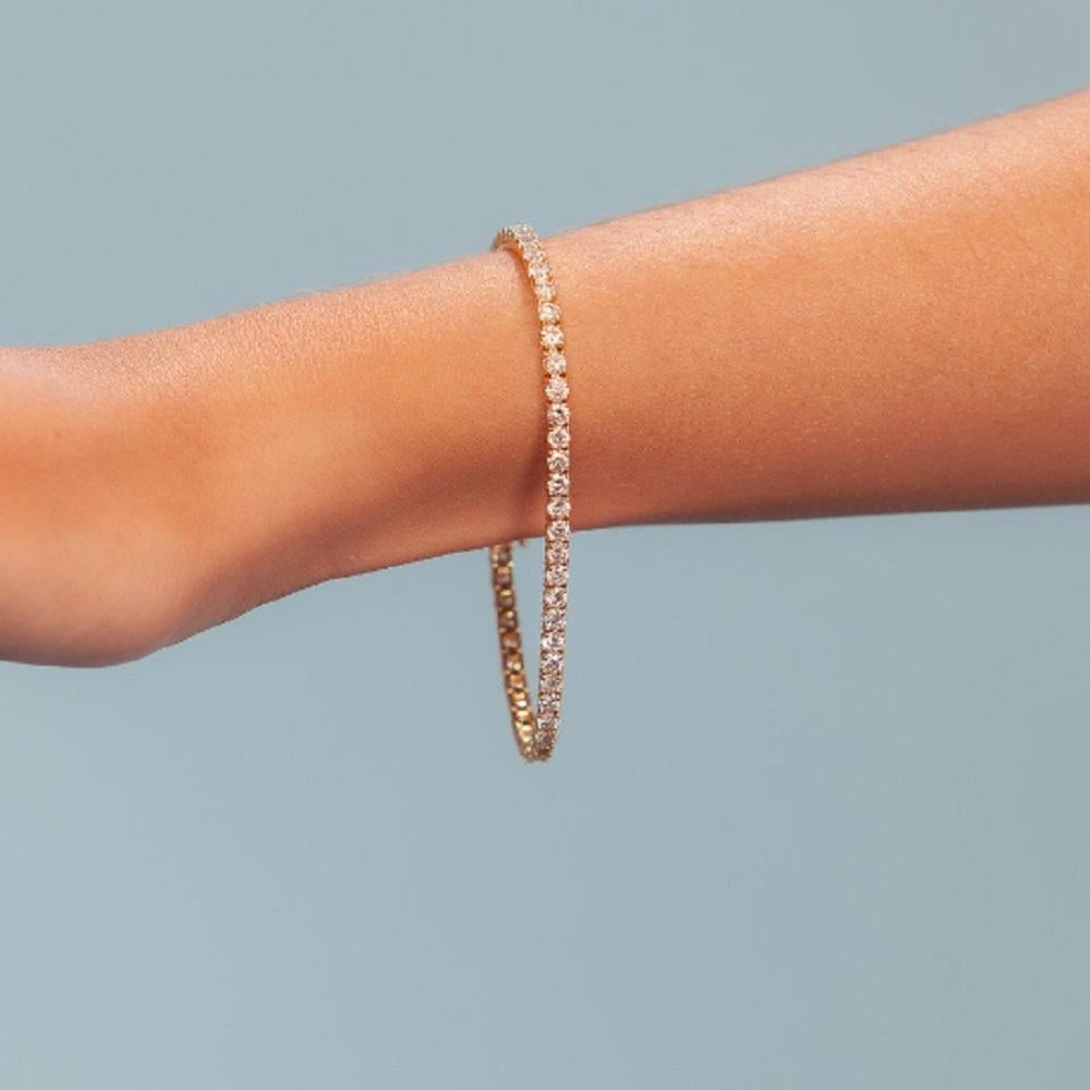 Beautiful Diamond Tennis Bracelet. A staple in your jewelry collection. Handmade in New York City. This tennis Bracelet showcases a delicate box chain embellished with dozens of shimmering white diamonds. Quality to us is important and that is why