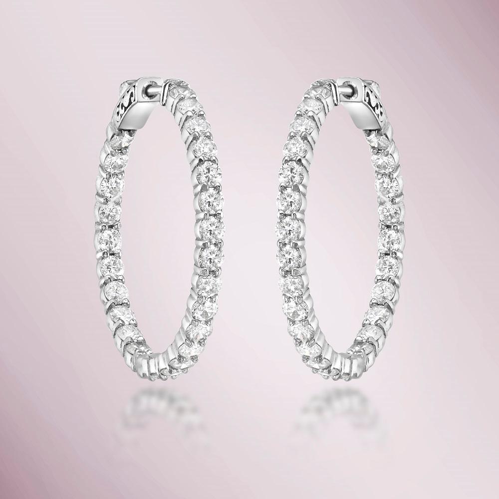 These exquisite Diamond Inside-Out 1.00'' Hoop Earrings earrings are crafted in 14K gold and feature a total of 4.00 carats of sparkling diamonds set on both the inside and outside of the hoop.
These earrings are substantial and demand attention.