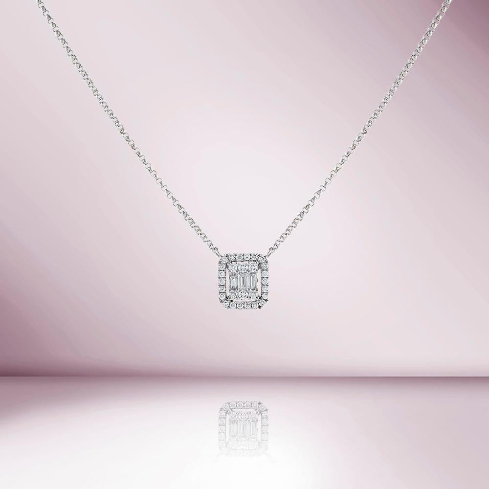The Double Halo Baguette Diamond Rectangular Shape Necklace is a piece of jewelry that features a rectangular-shaped pendant with baguette diamond in the center surrounded by a double halo of round diamonds.
This specific necklace has a total carat