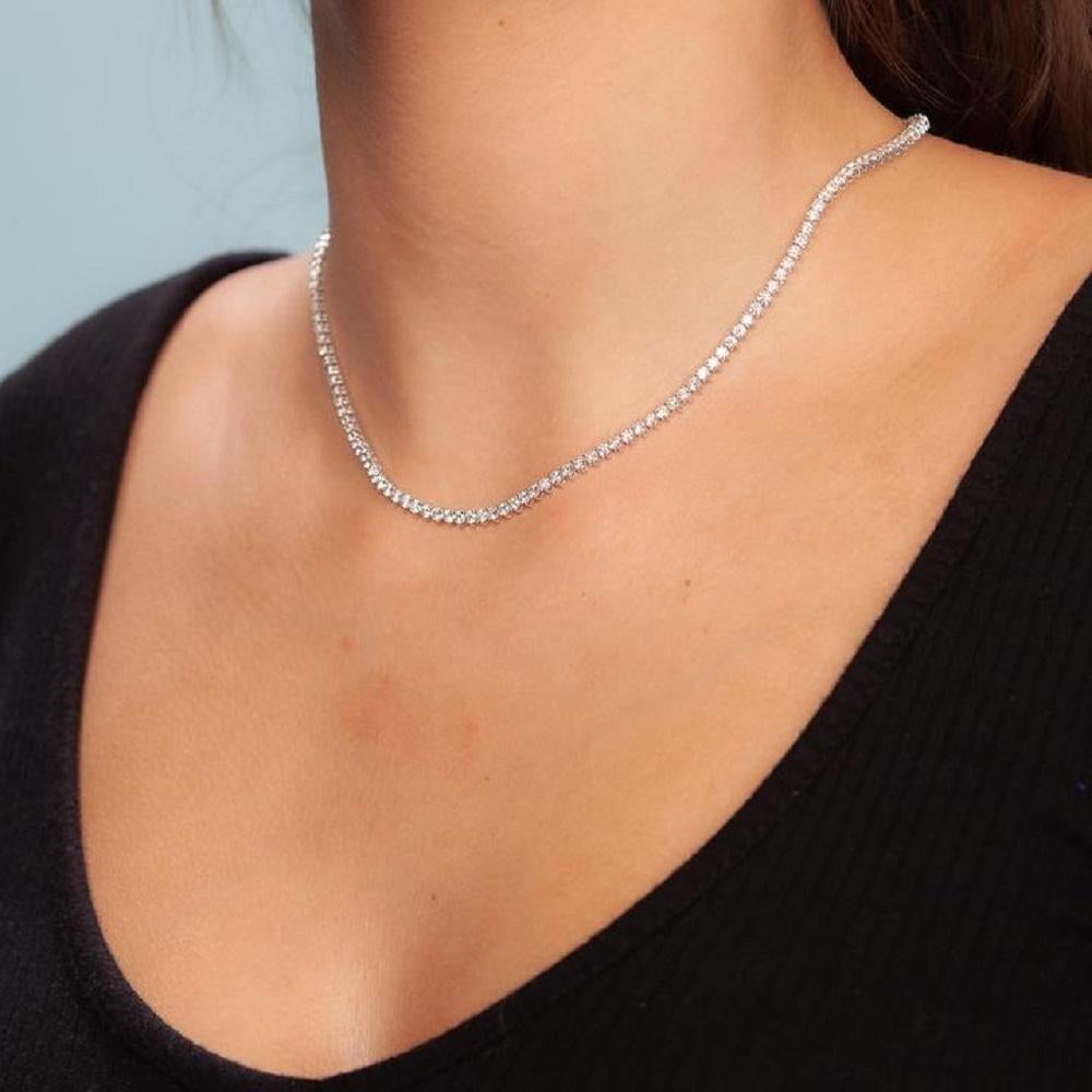 Description
Beautiful Diamond Tennis Necklace. A staple in your jewelry collection. Handmade in New York City. This tennis necklace showcases a delicate 3 Prongs chain embellished with dozens of shimmering white diamonds. Quality to us is important