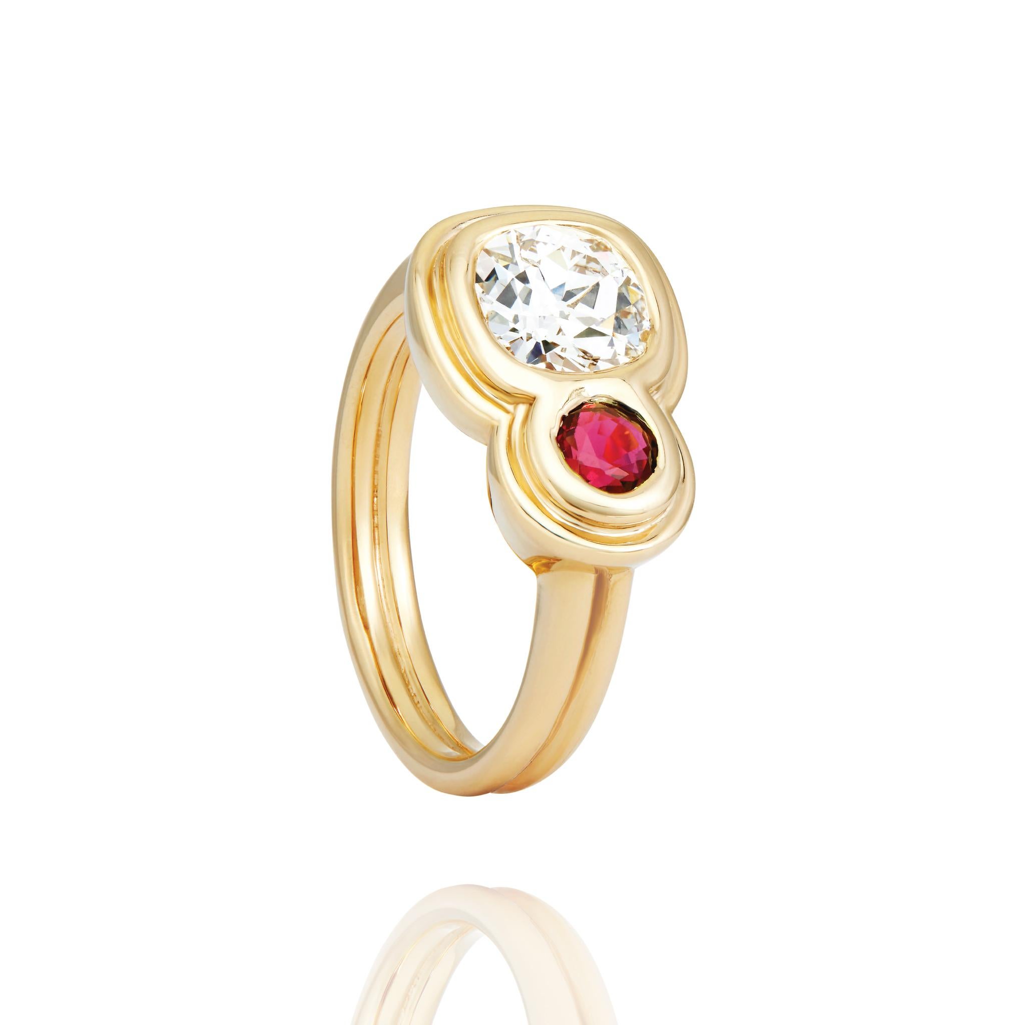 Capulet Toi Et Moi Ring with 1.17 Carat Antique Cushion Cut Diamond  and .25 Carat Ruby in 14k gold. This luxurious ring combines a gorgeous antique cushion cut natural diamond with a vibrant red ruby in a modern toi et moi ring design.  Ring is