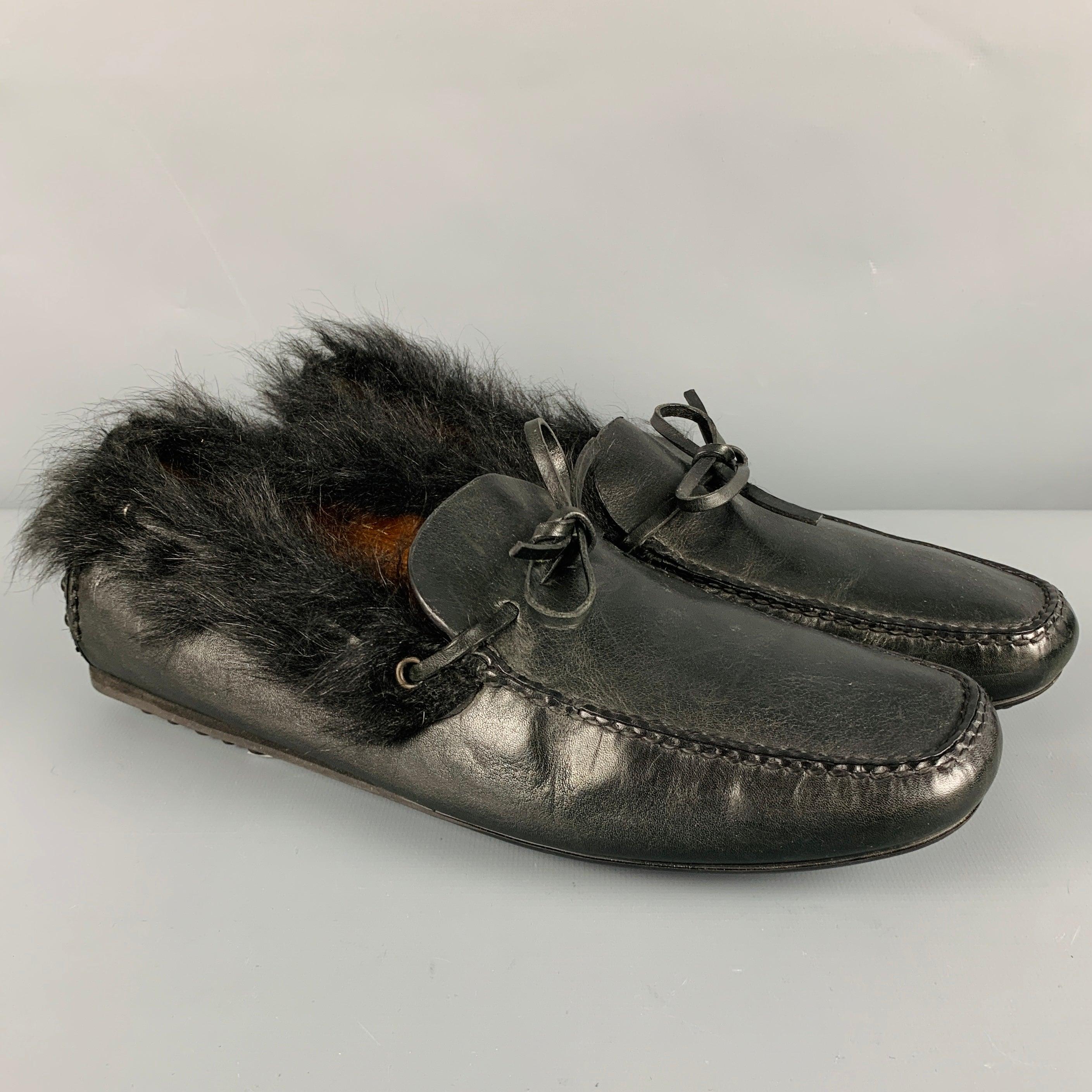 CAR SHOE loafers
in a black leather fabric featuring a driver's style, fur trim, bow detail, and slip on closure. Made in Italy.Very Good Pre-Owned Condition. Minor signs of wear on fur trim. 

Marked:   80078 COutsole: 11 inches  x 4 inches 
  
  
